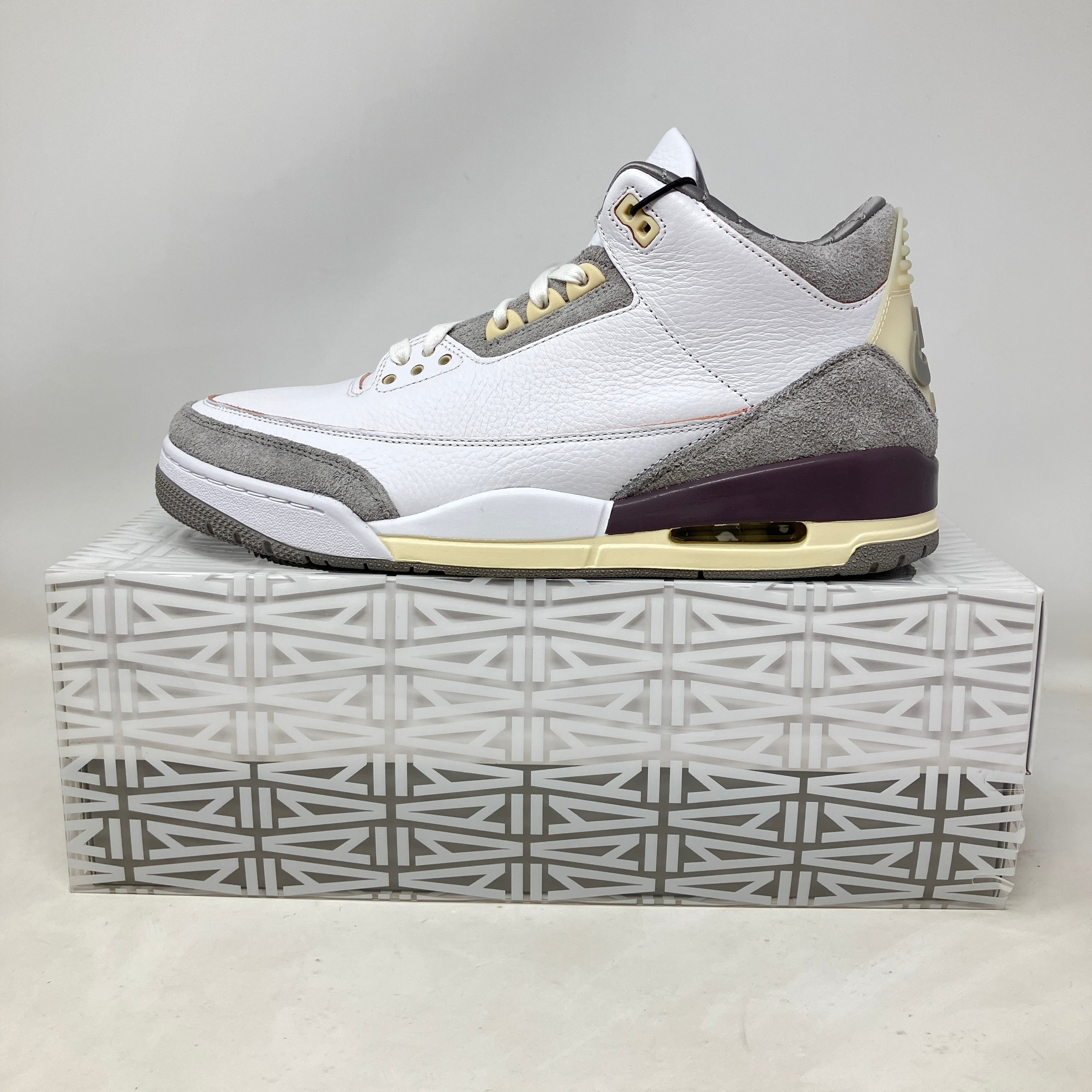 Jordan 3 Retro SP A Ma Maniére women's sneaker in white, grey, and cream on patterned box