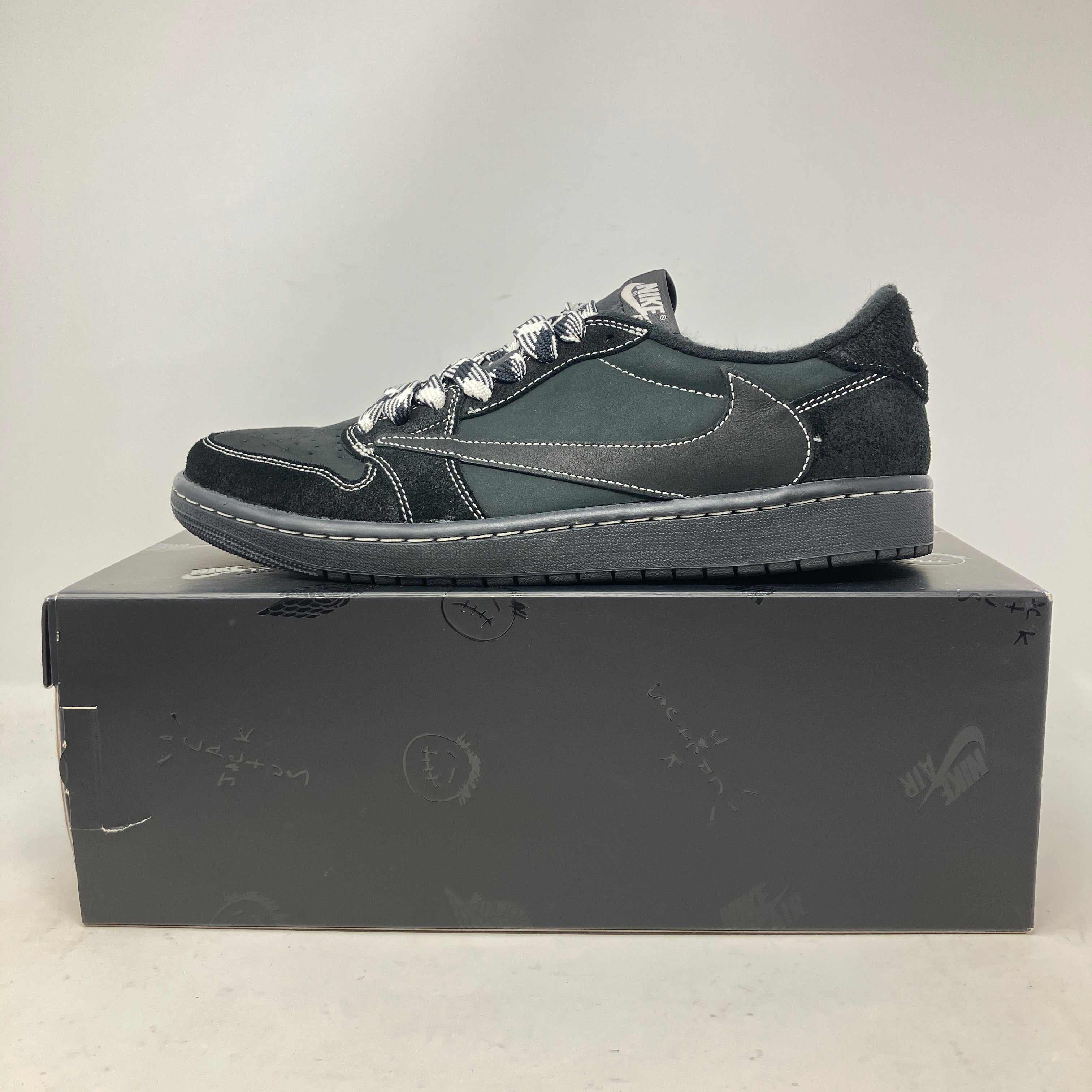 Jordan 1 Retro Low OG SP Travis Scott Black Phantom sneakers on box, pre-owned condition.