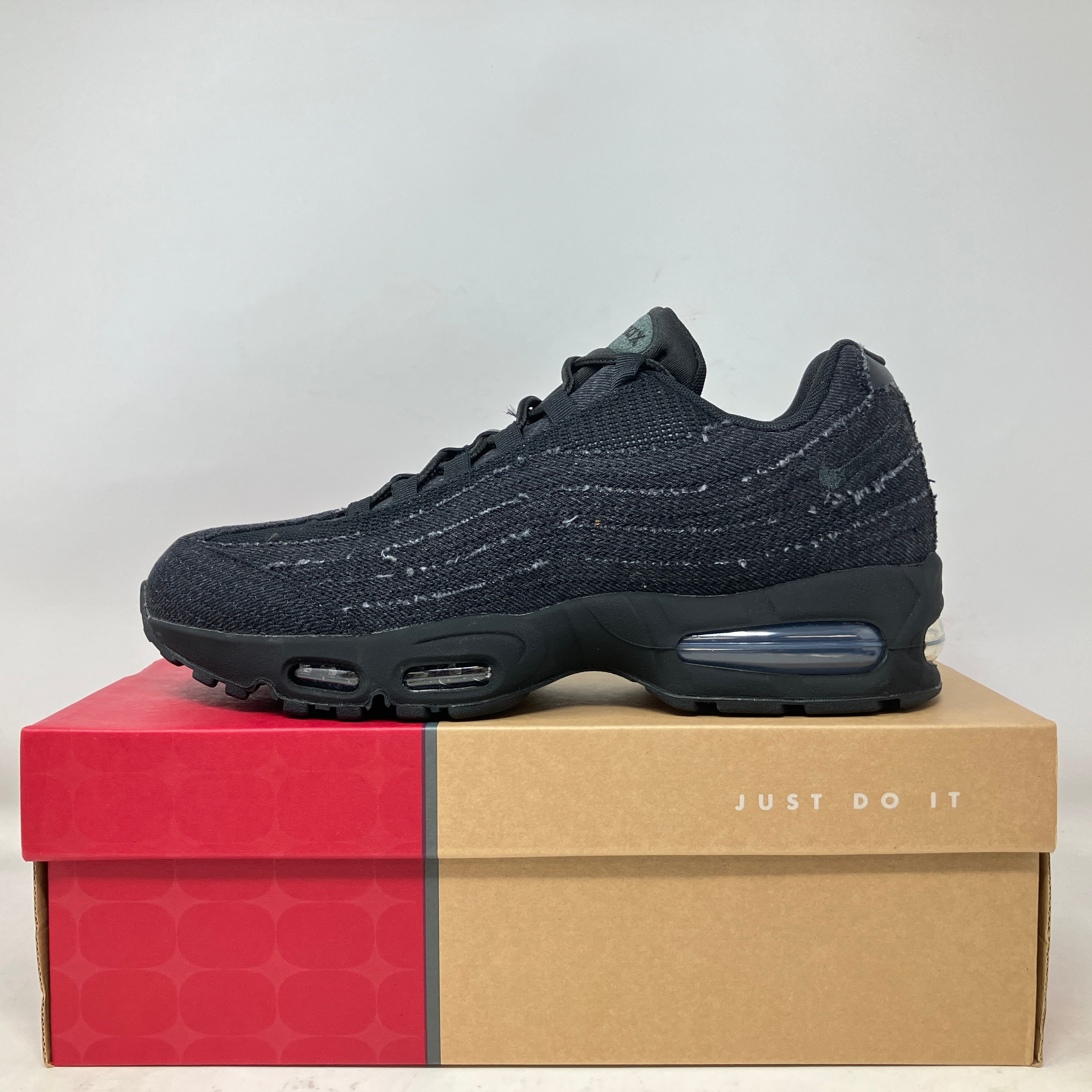 Nike Air Max 95 OG Levis black sneaker on branded red and tan Nike box with Just Do It slogan