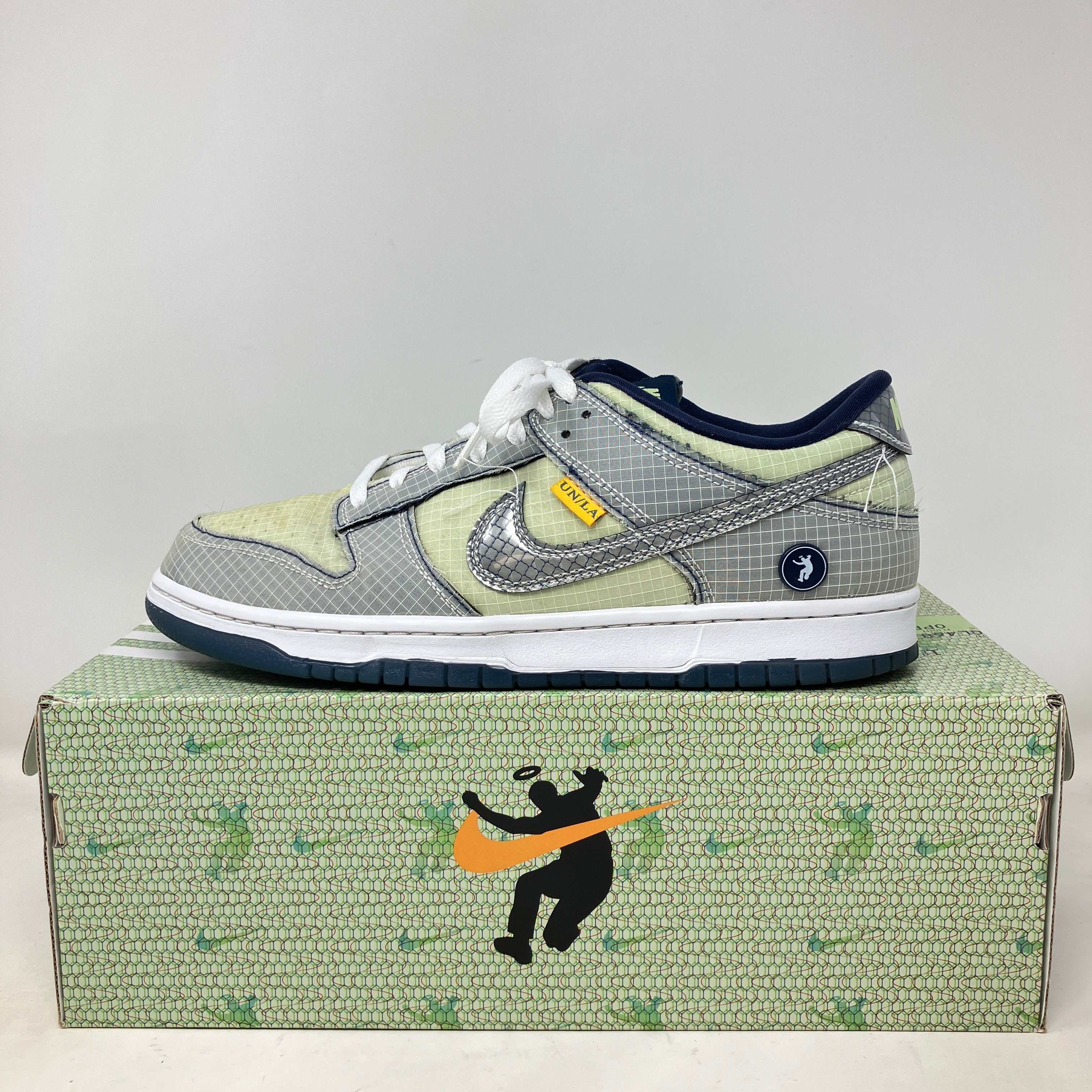 Nike Dunk Low Union Passport Pack Pistachio sneaker on patterned box with pre-owned condition and all accessories included