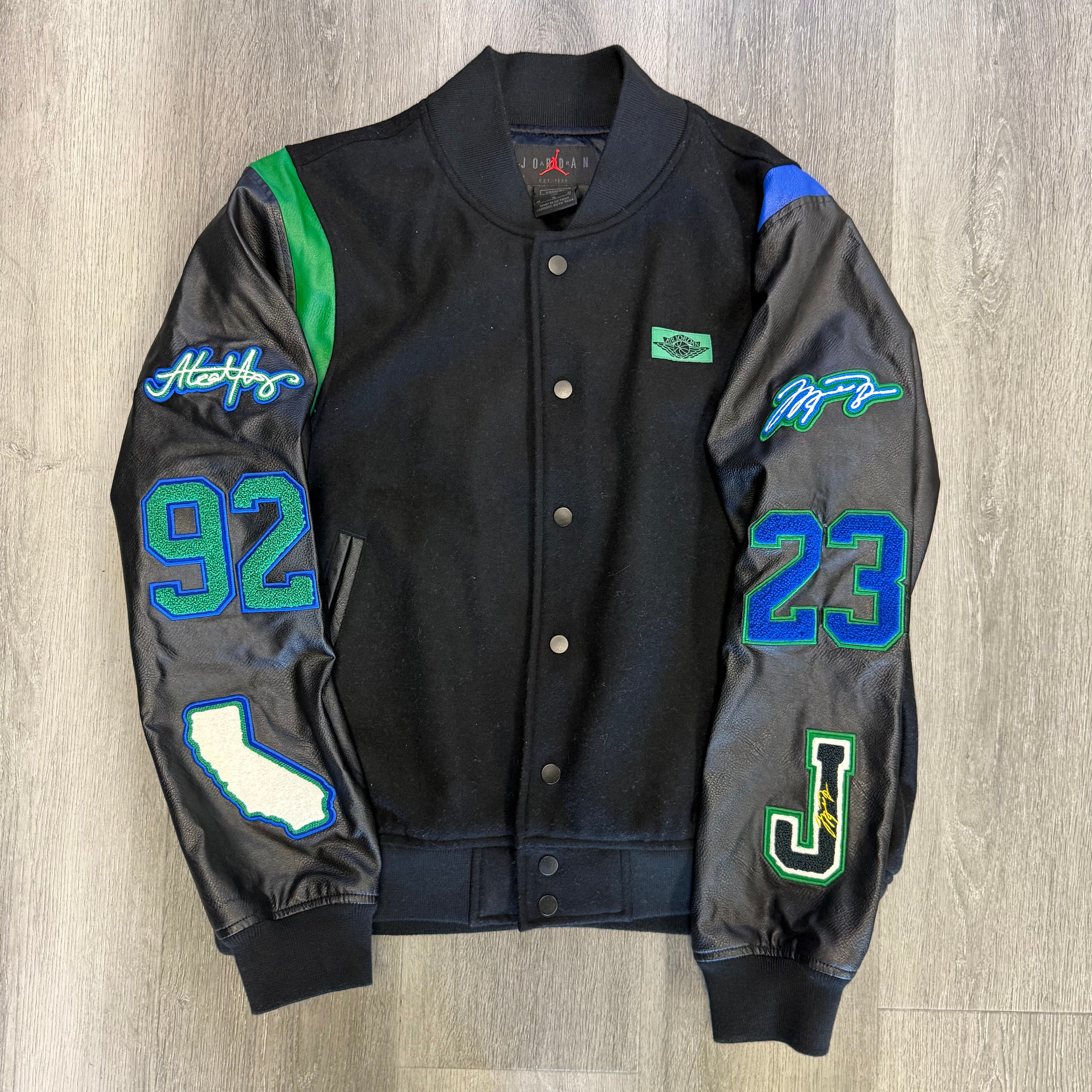 Jordan x Aleali May Varsity Jacket Black Game Royal Pine Green