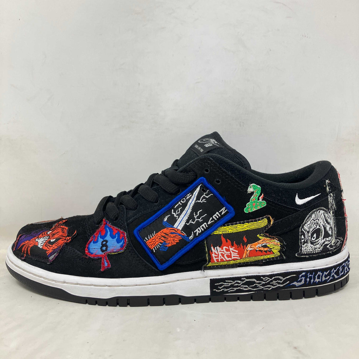 Nike SB Dunk Low Pro QS pre-owned sneakers with patches, no box