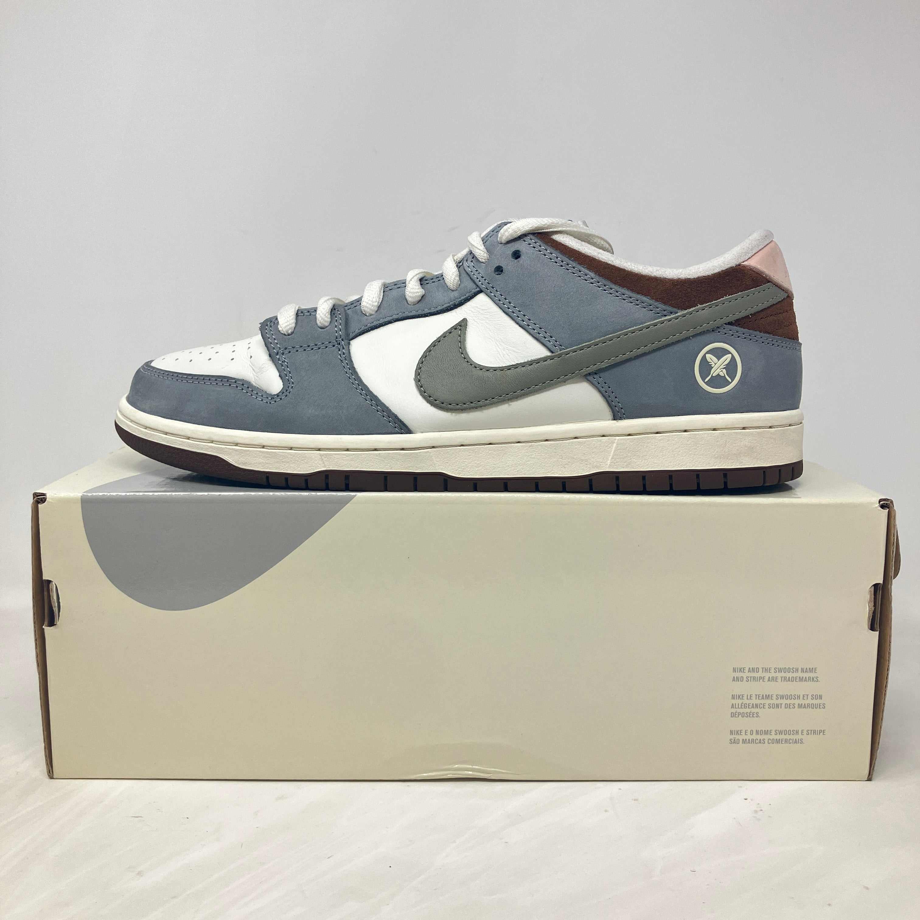 Nike SB Dunk Low Yuto Horigome sneaker in gray and white on box, pre-owned with accessories