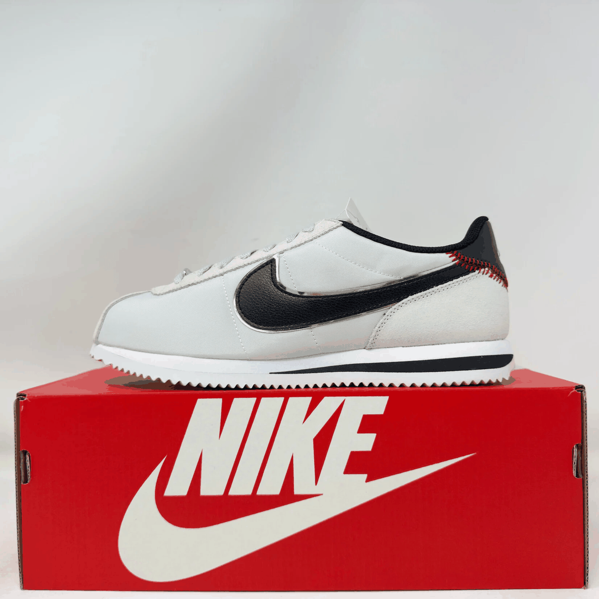 Nike Cortez TXT Jackie Robinson Day sneaker in white and black on red Nike box new condition