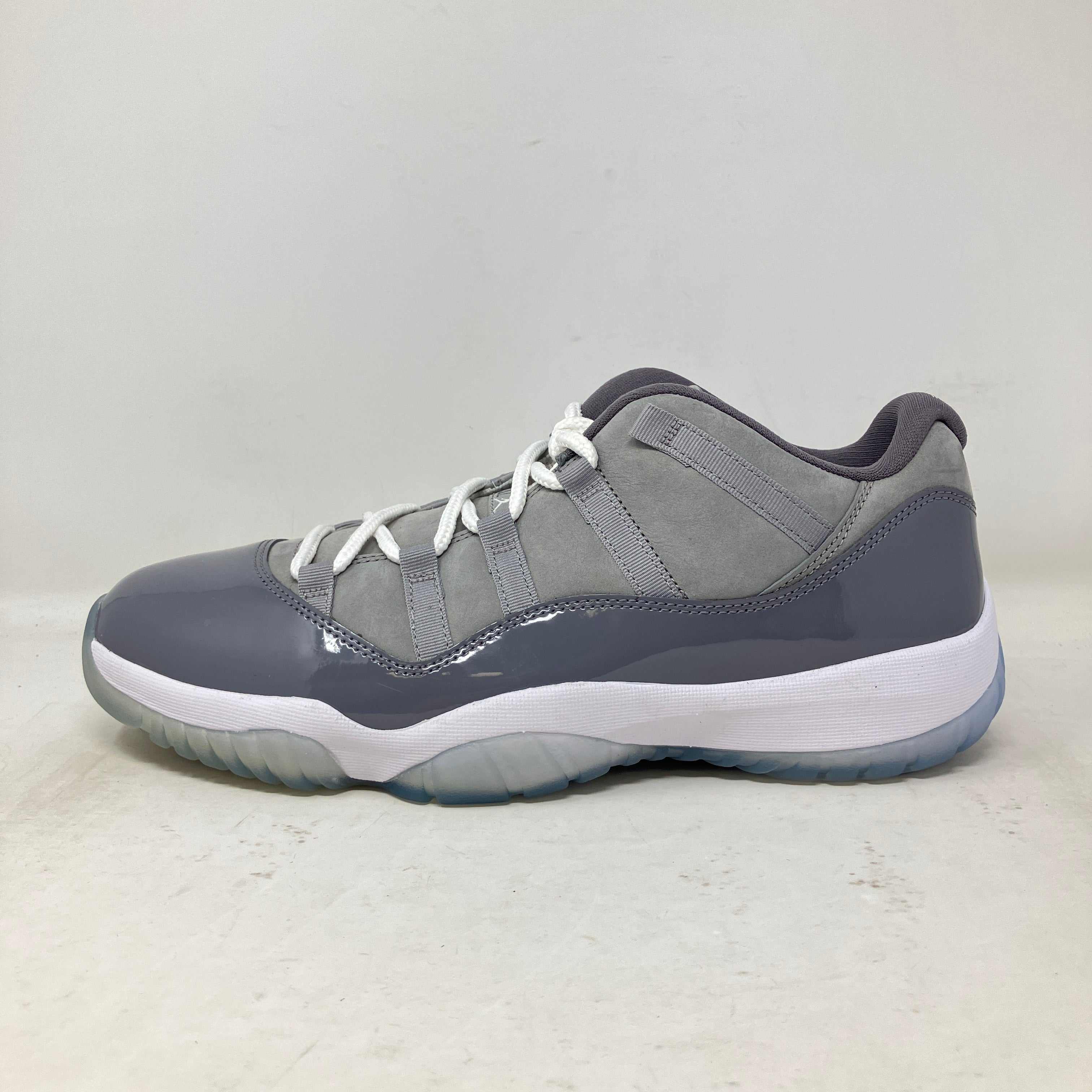 Side view of brand new Jordan 11 Retro Low Cool Grey sneaker without box