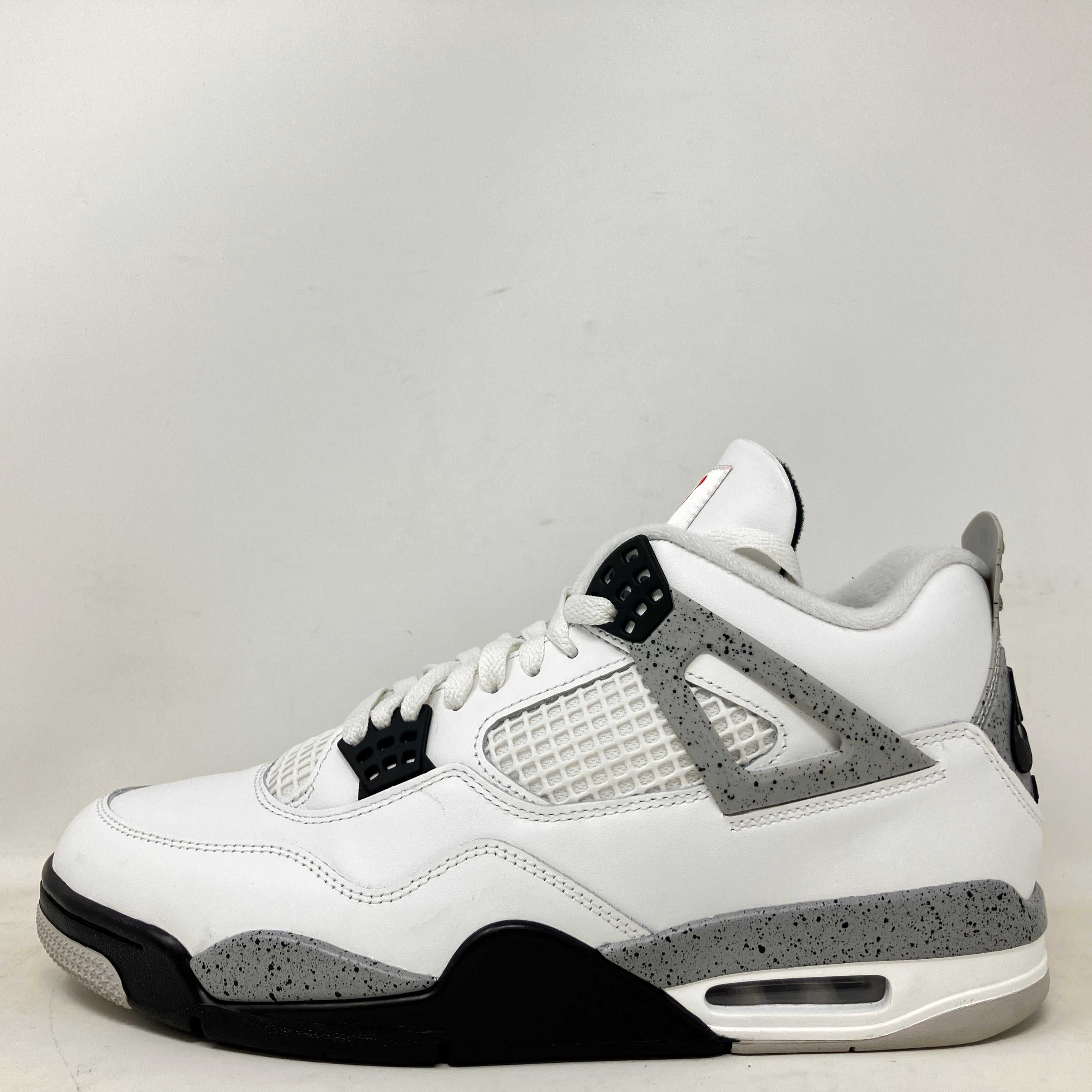 Pre owned Jordan 4 Retro White Cement sneaker with grey and black accents, no box included.