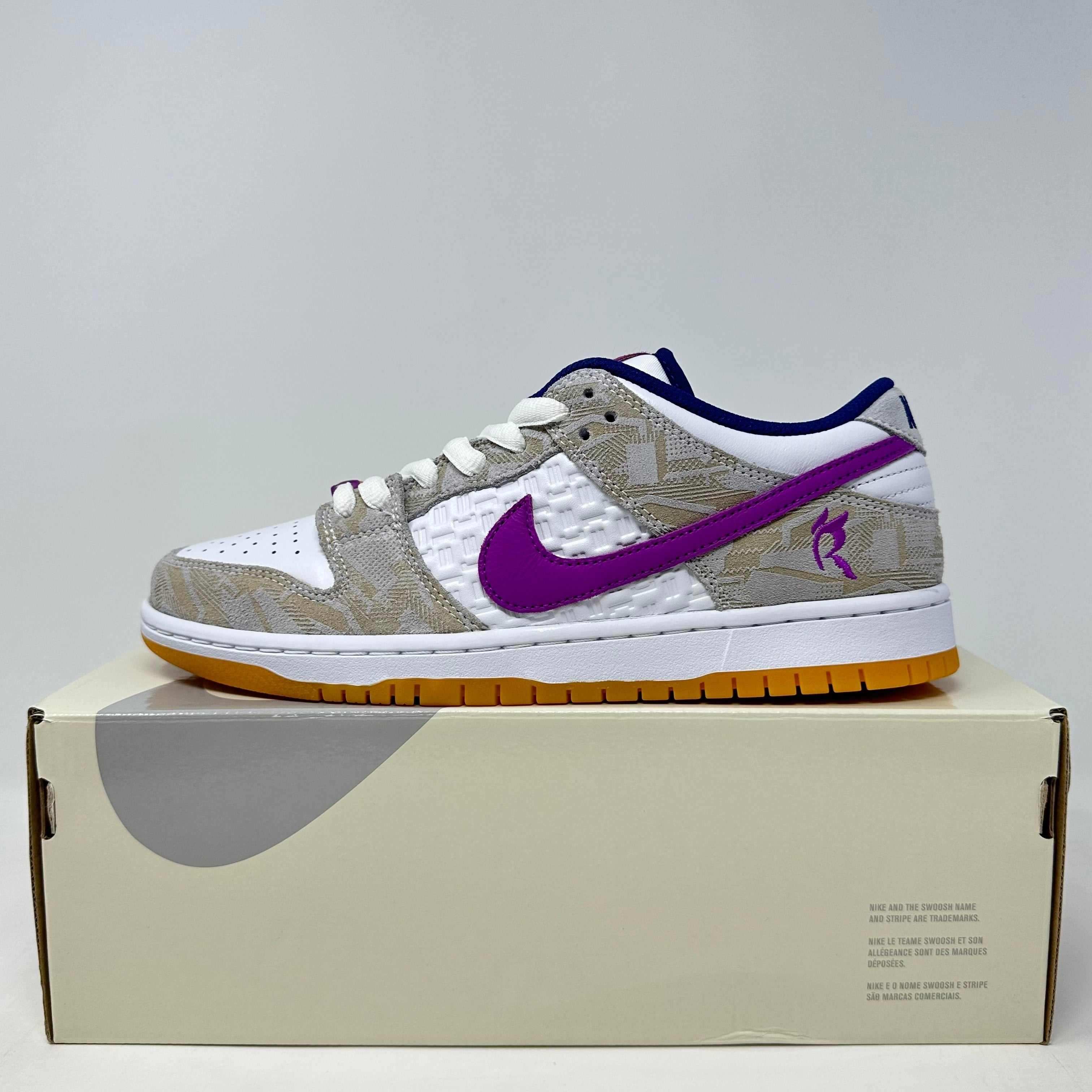 Nike SB Dunk Low Rayssa Leal white and beige sneaker with purple swoosh on box