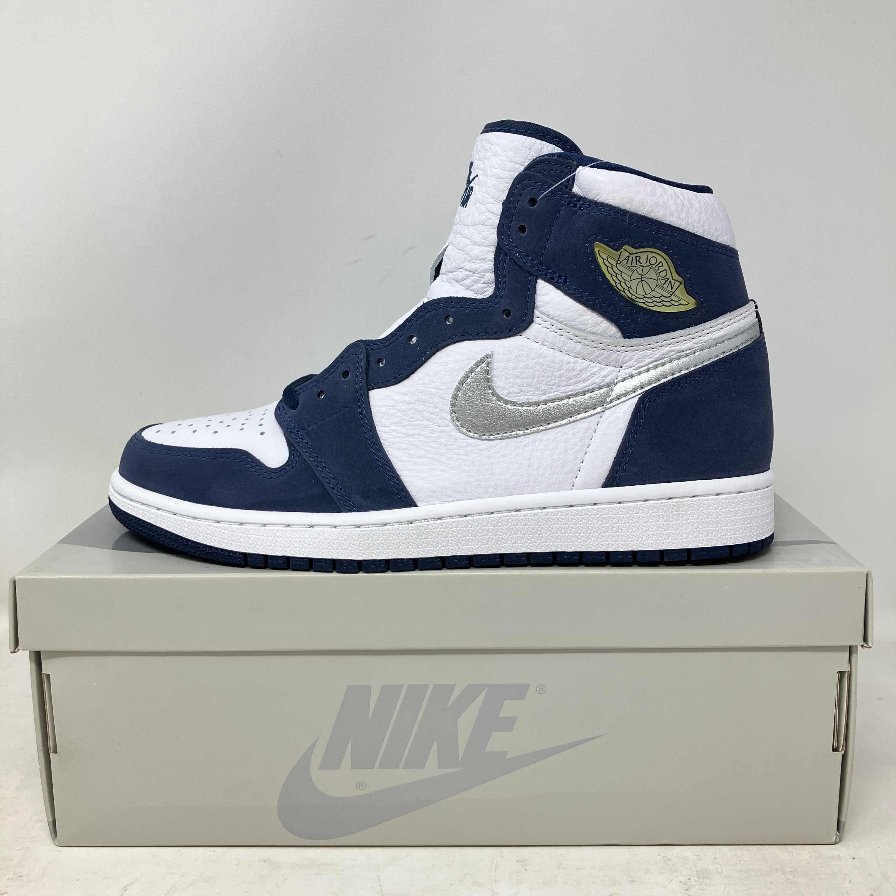 Jordan 1 Retro High CO Japan Midnight Navy sneaker in white and navy on Nike box, brand new with accessories included