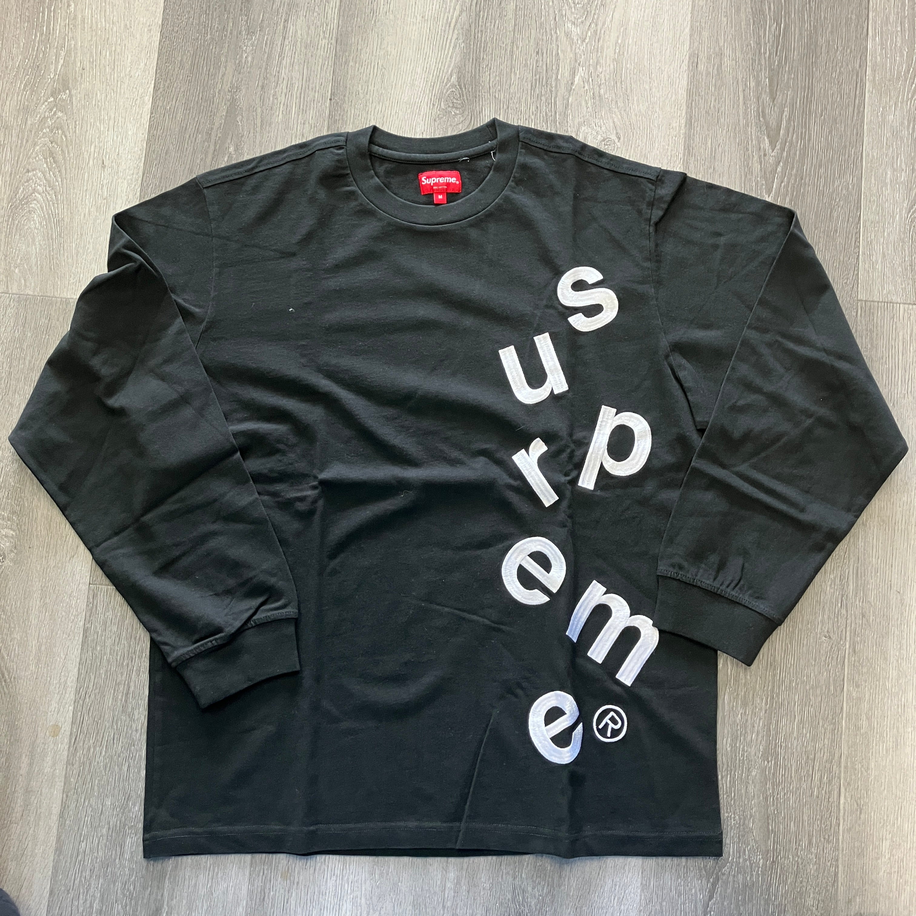 Supreme Scatter Logo L/S Top black long sleeve shirt with diagonal white logo lettering, brand new