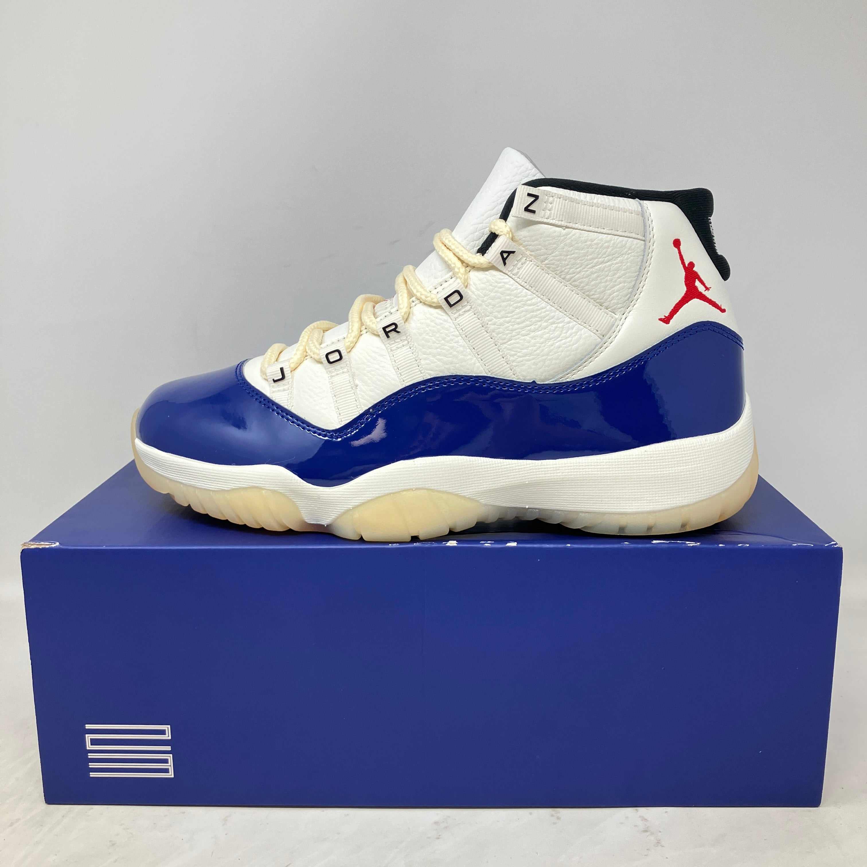 Brand new Jordan 11 Retro Rare Air sneakers with iconic design and original accessories