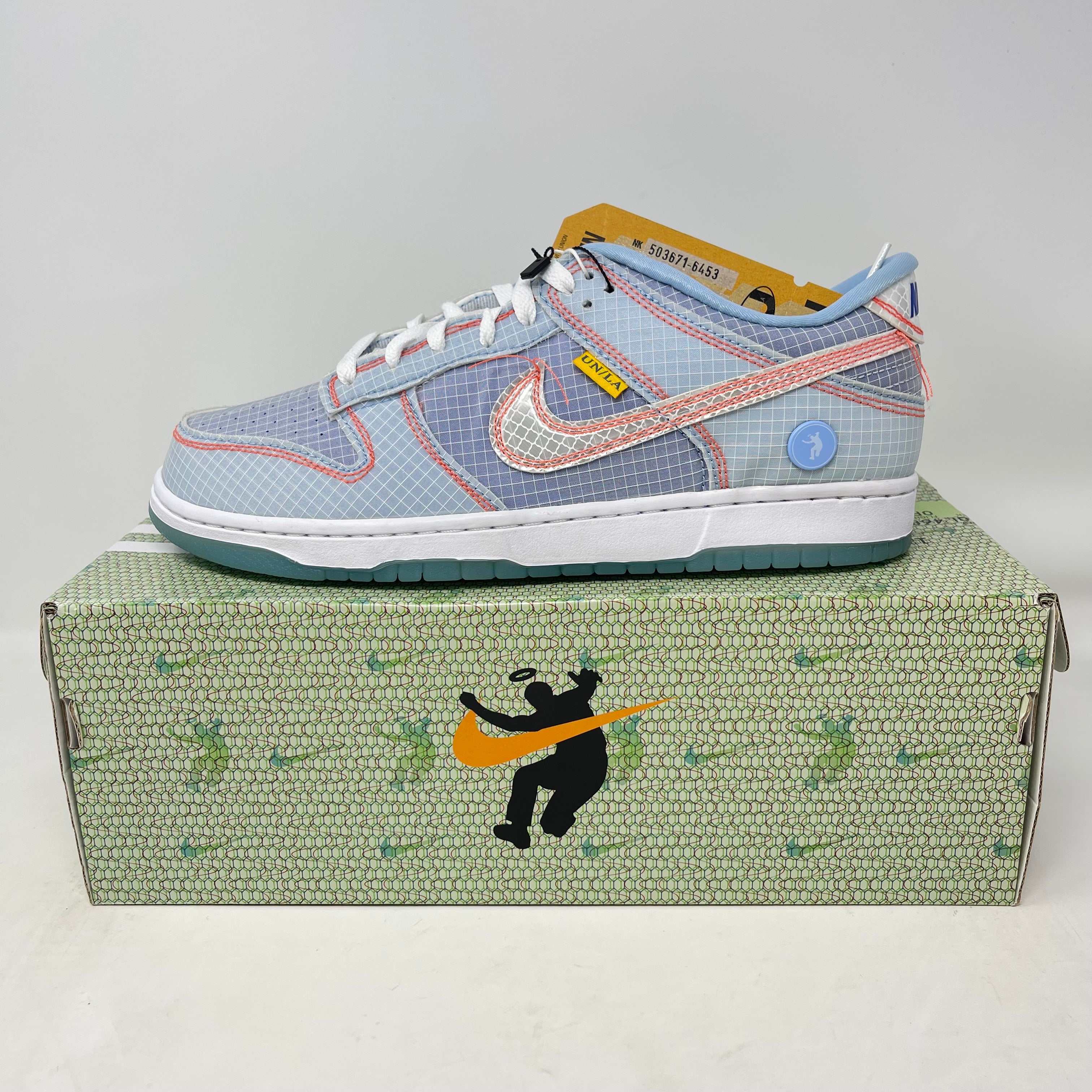Nike Dunk Low Union Passport Pack Argon sneaker with oxidized upper on green patterned box