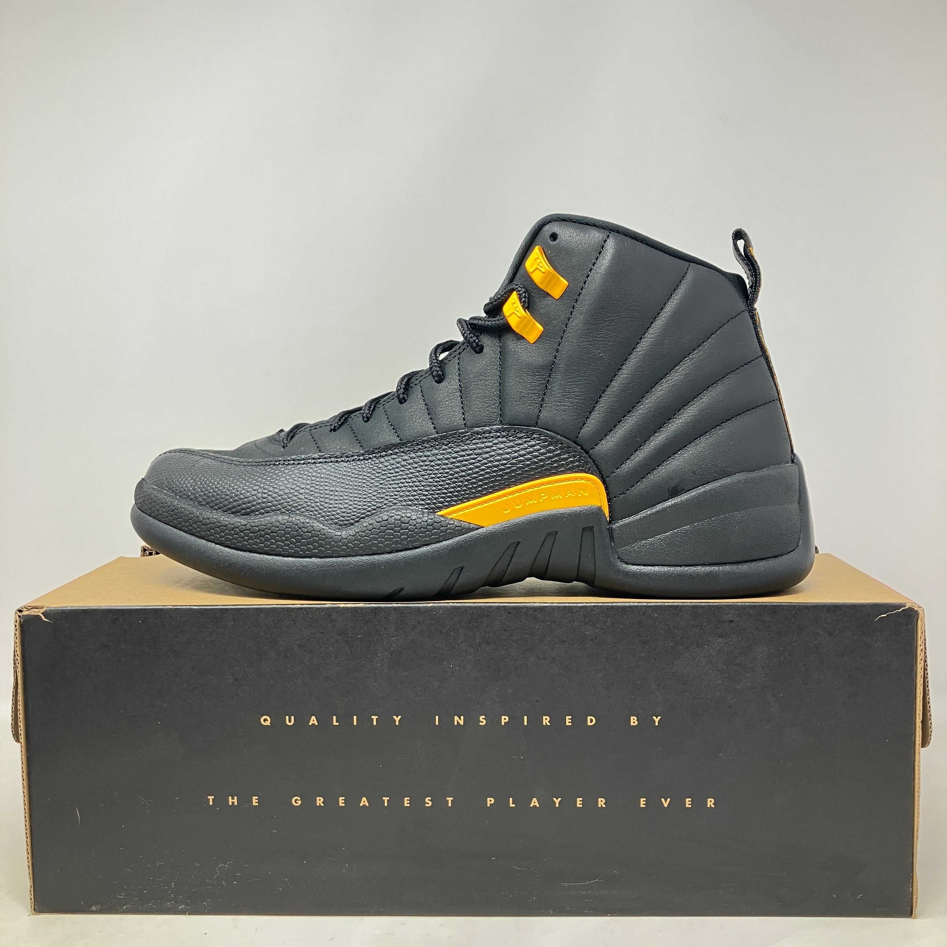 Jordan 12 Retro Black Taxi sneaker in black and yellow on box with quality inspired by the greatest player text