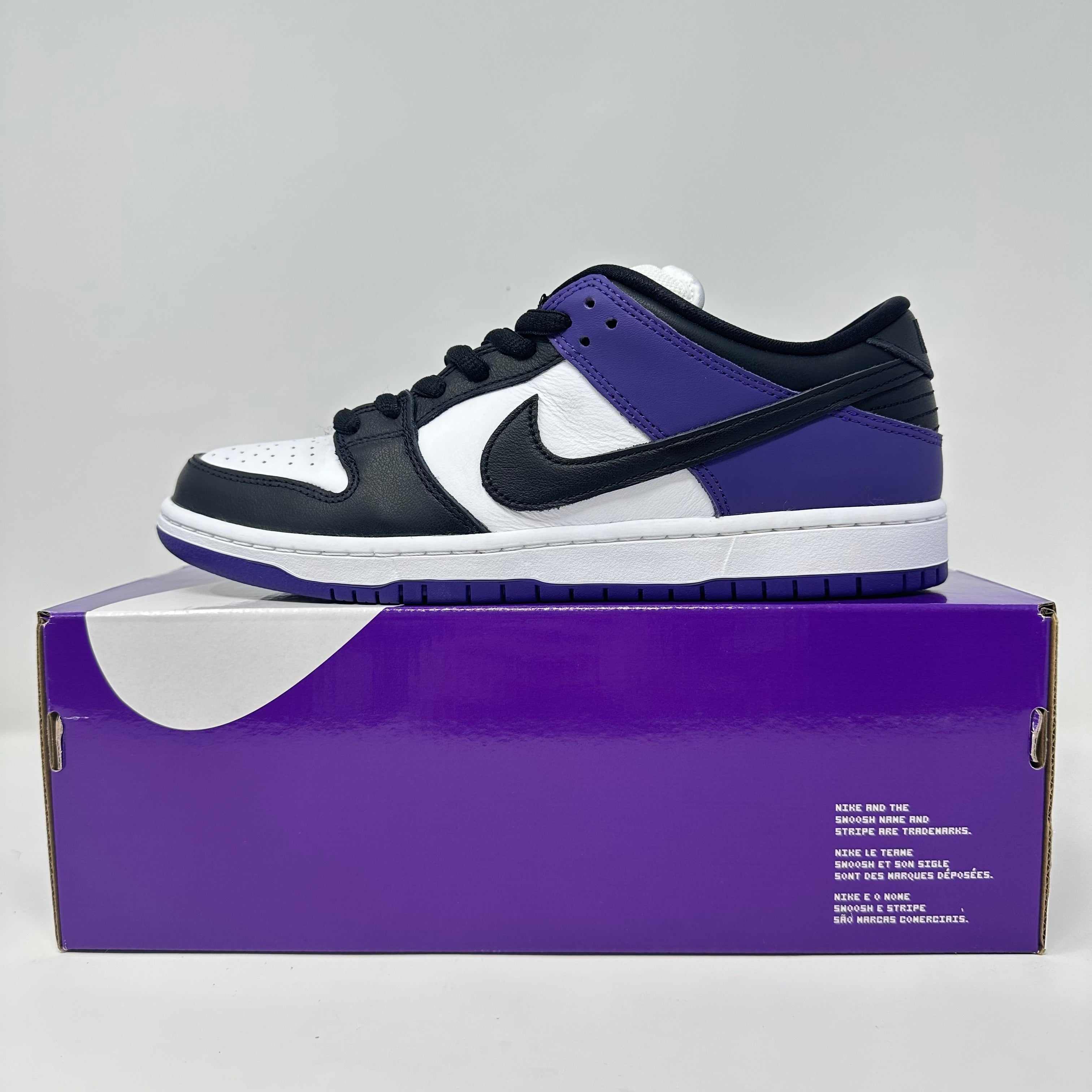 Nike SB Dunk Low Court Purple sneakers on box, brand new condition.