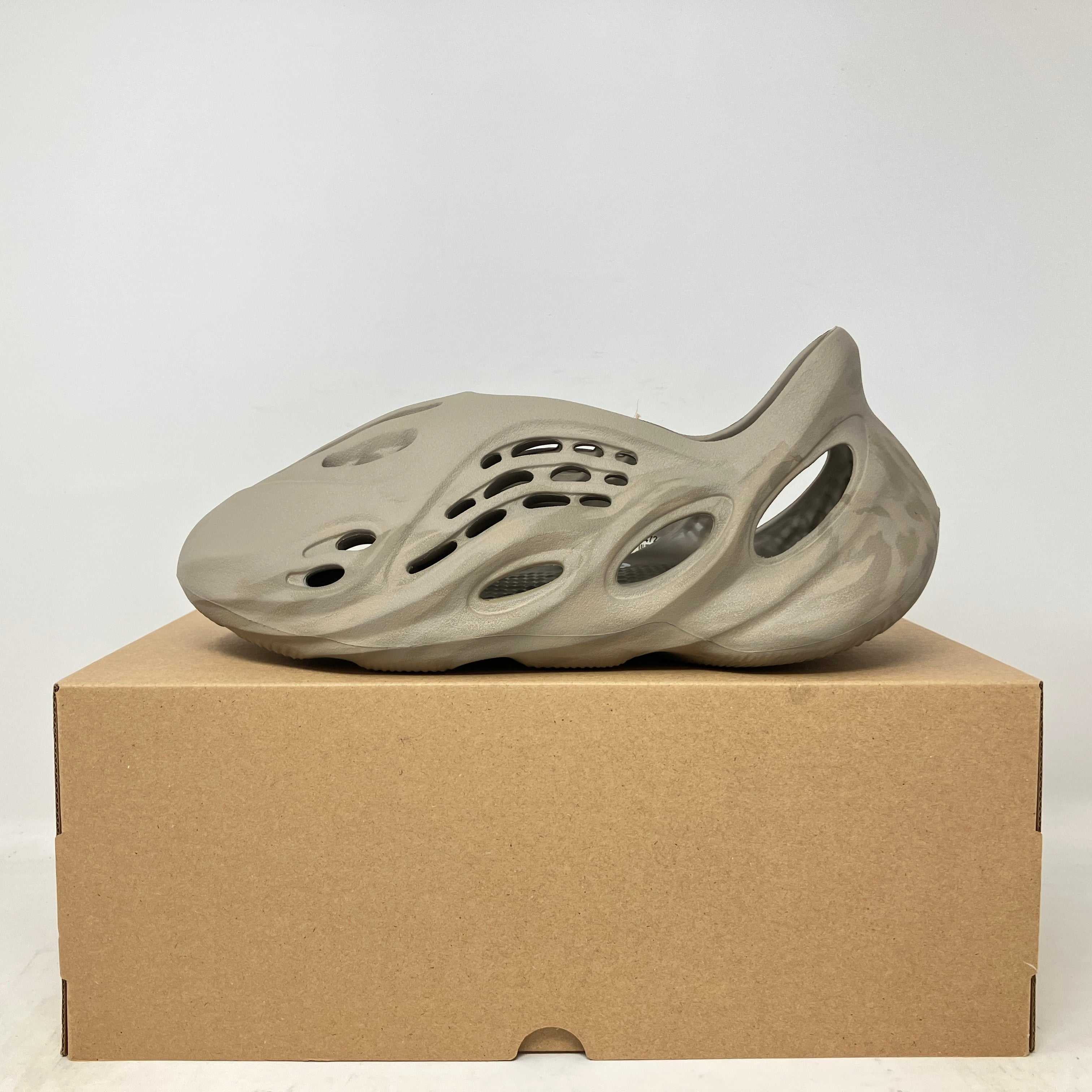 adidas Yeezy Foam RNNR Stone Sage sneaker in brand new condition displayed on a cardboard box