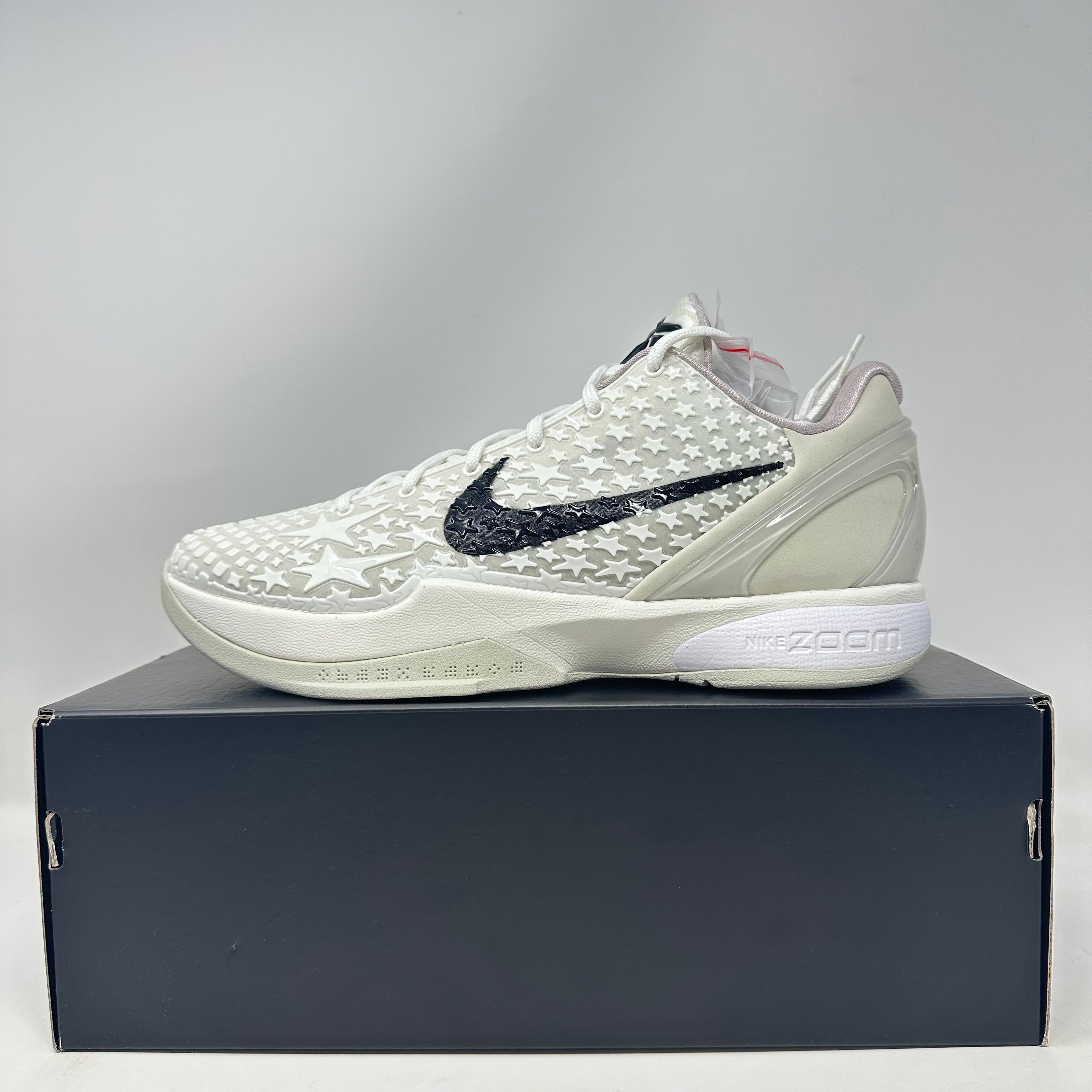 Nike Kobe 6 Protro Sail All-Star basketball shoe in white with black Nike swoosh on black shoebox