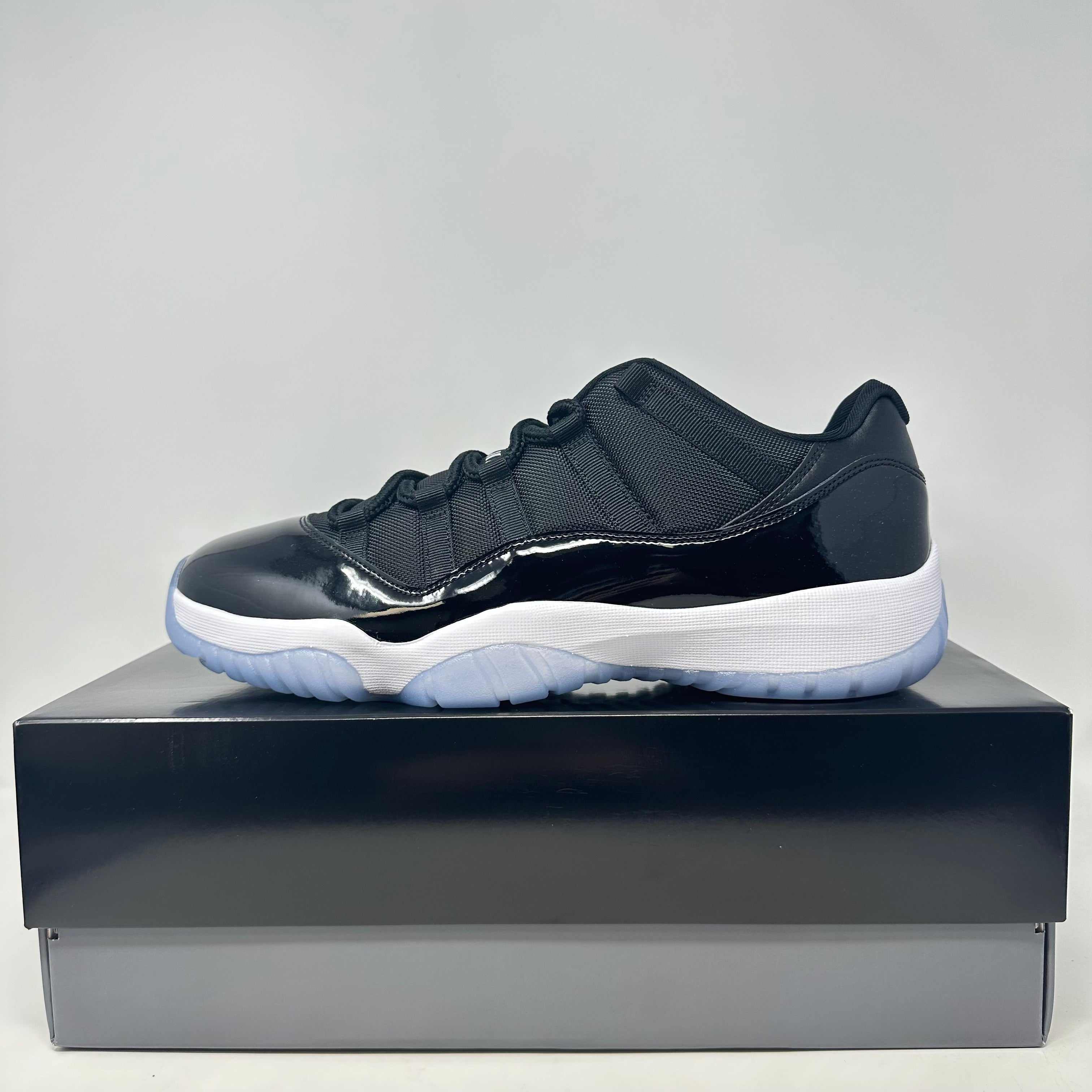 Jordan 11 Retro Low Space Jam sneaker in black and white on box, size 9.5, brand new