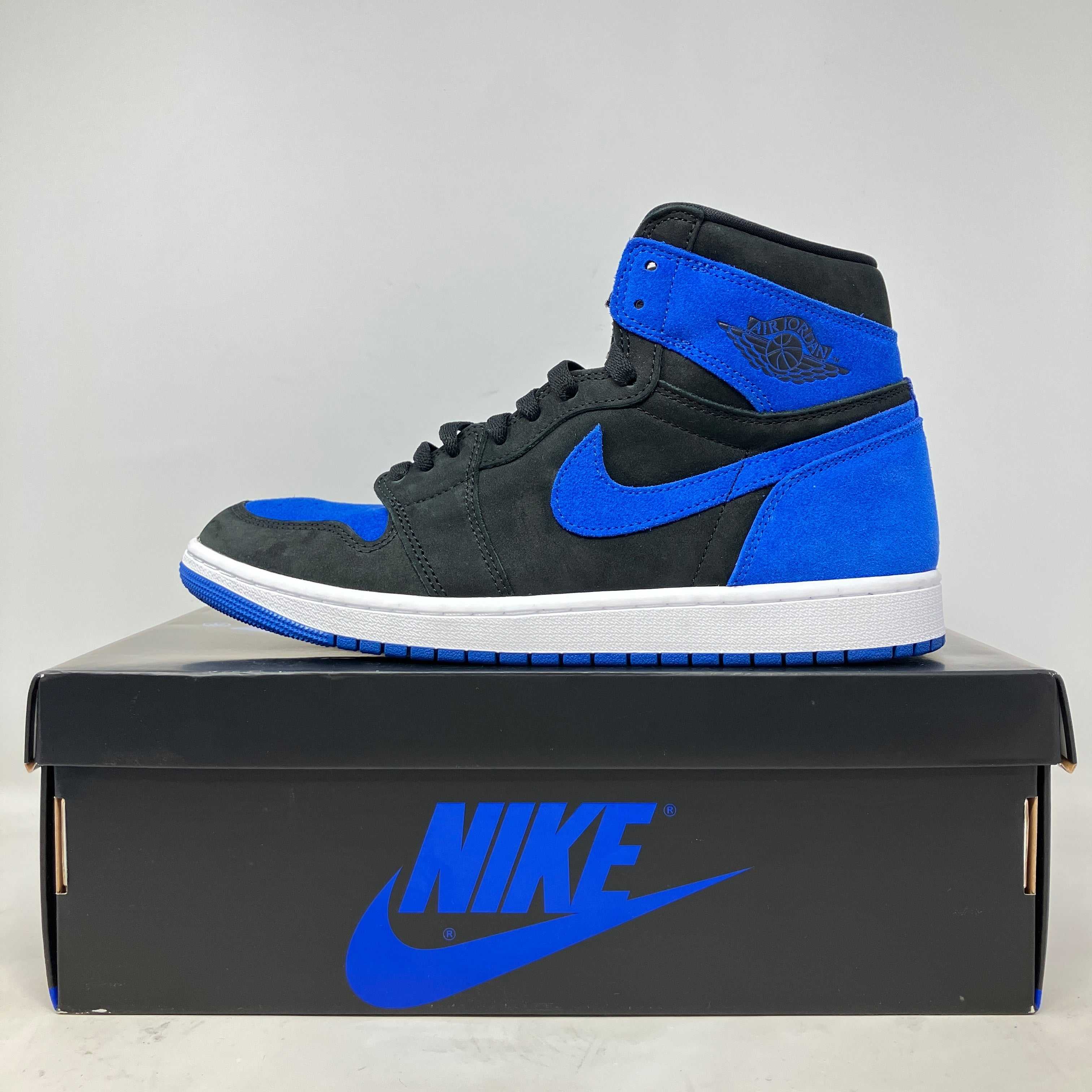 Jordan 1 Retro High OG Royal sneaker in black and blue on Nike shoebox, pre-owned with accessories included