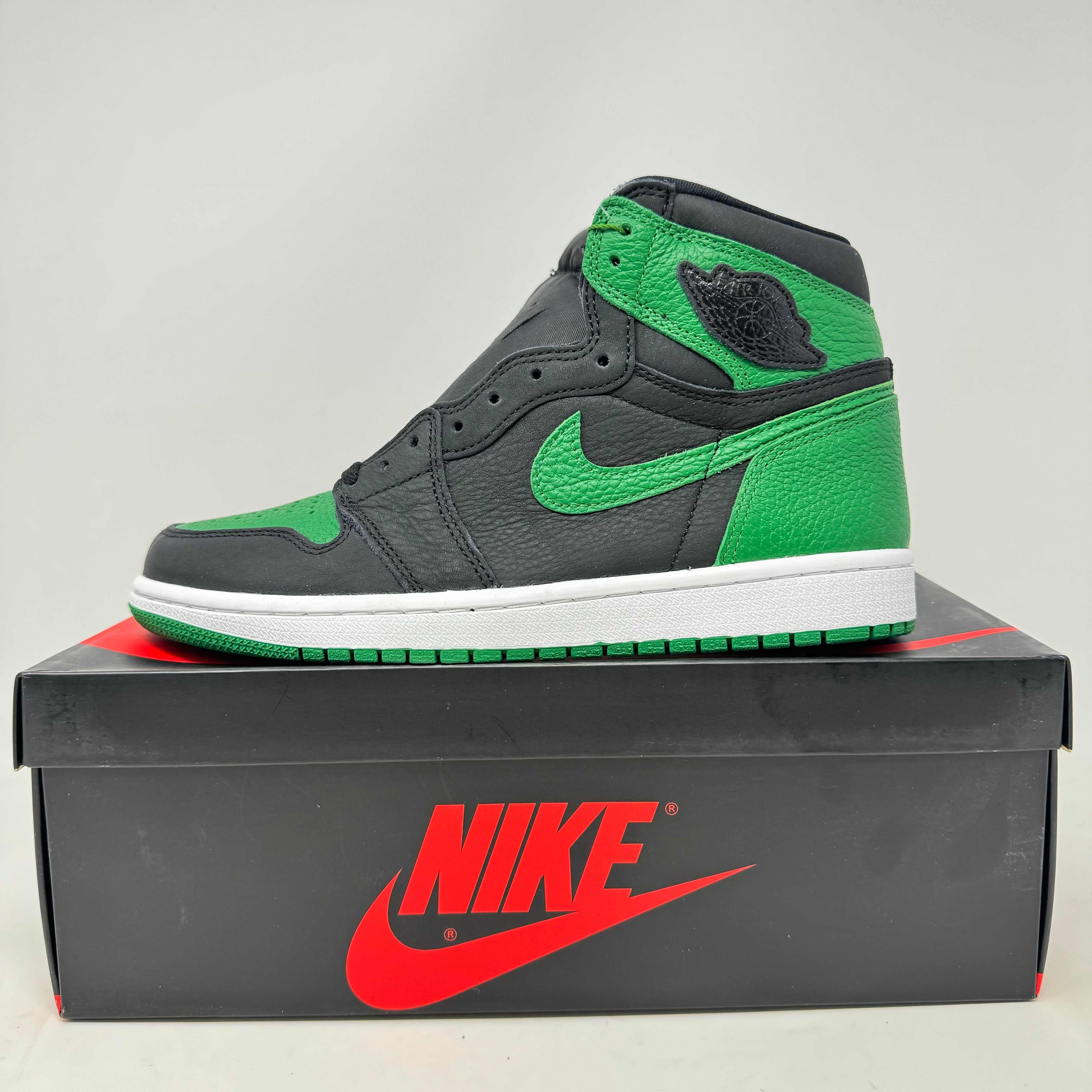Jordan 1 Retro High Pine Green Black sneaker on black Nike box.