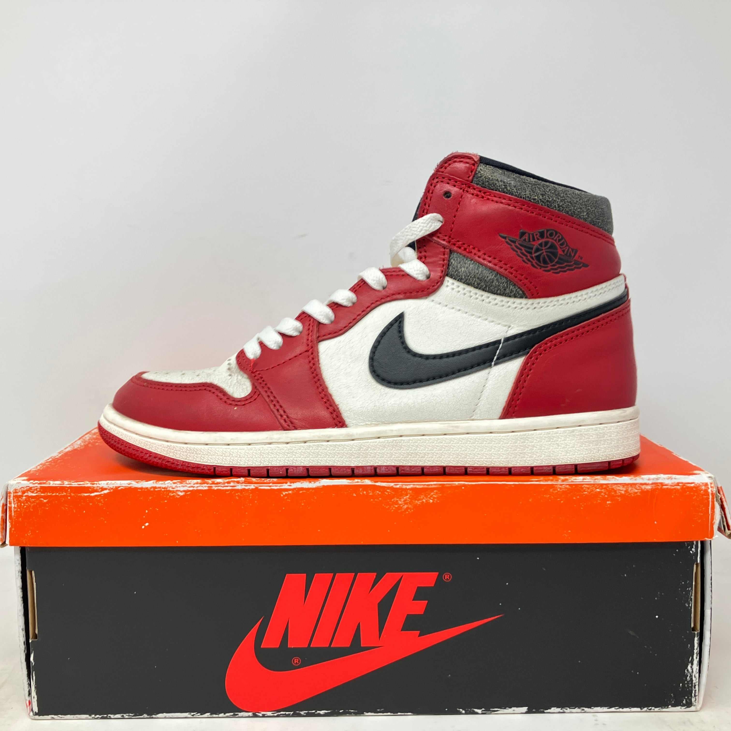 Pre-owned Jordan 1 Retro High OG Chicago Lost and Found sneaker with accessories on Nike box
