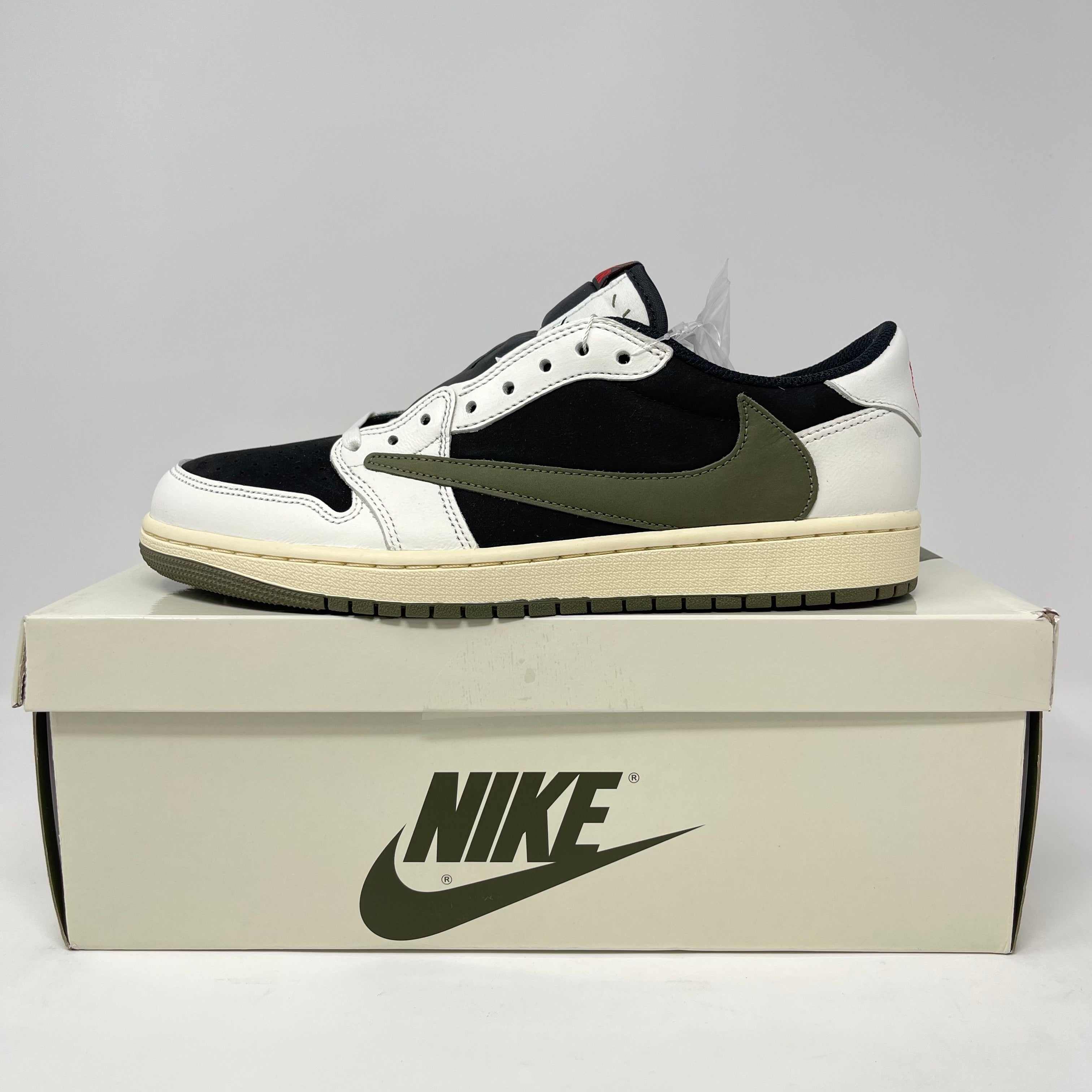 Jordan 1 Retro Low OG Travis Scott Olive women's sneaker in black, white, and olive on Nike box
