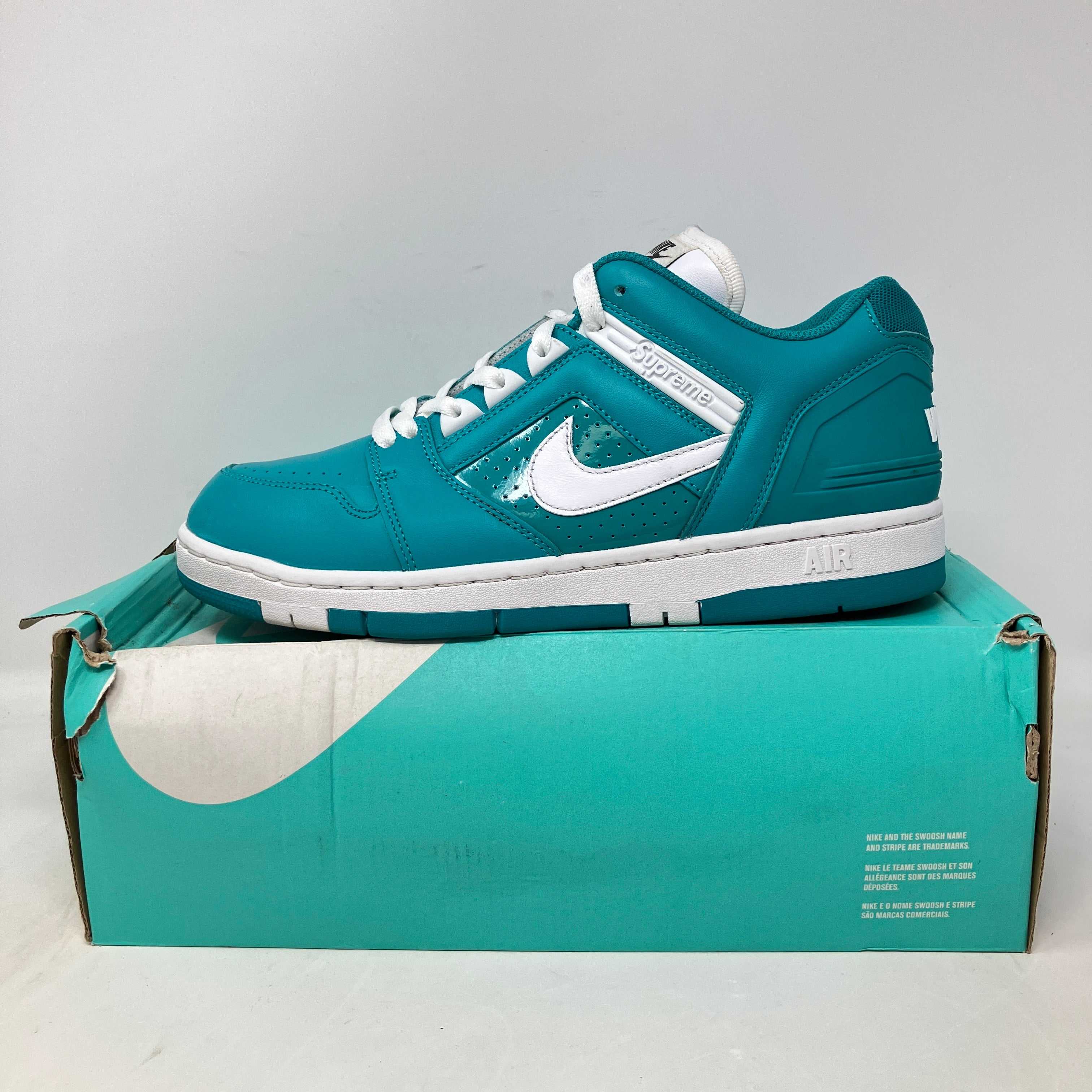 Nike SB Air Force 2 Low Supreme Blue sneaker on box, pre-owned condition.
