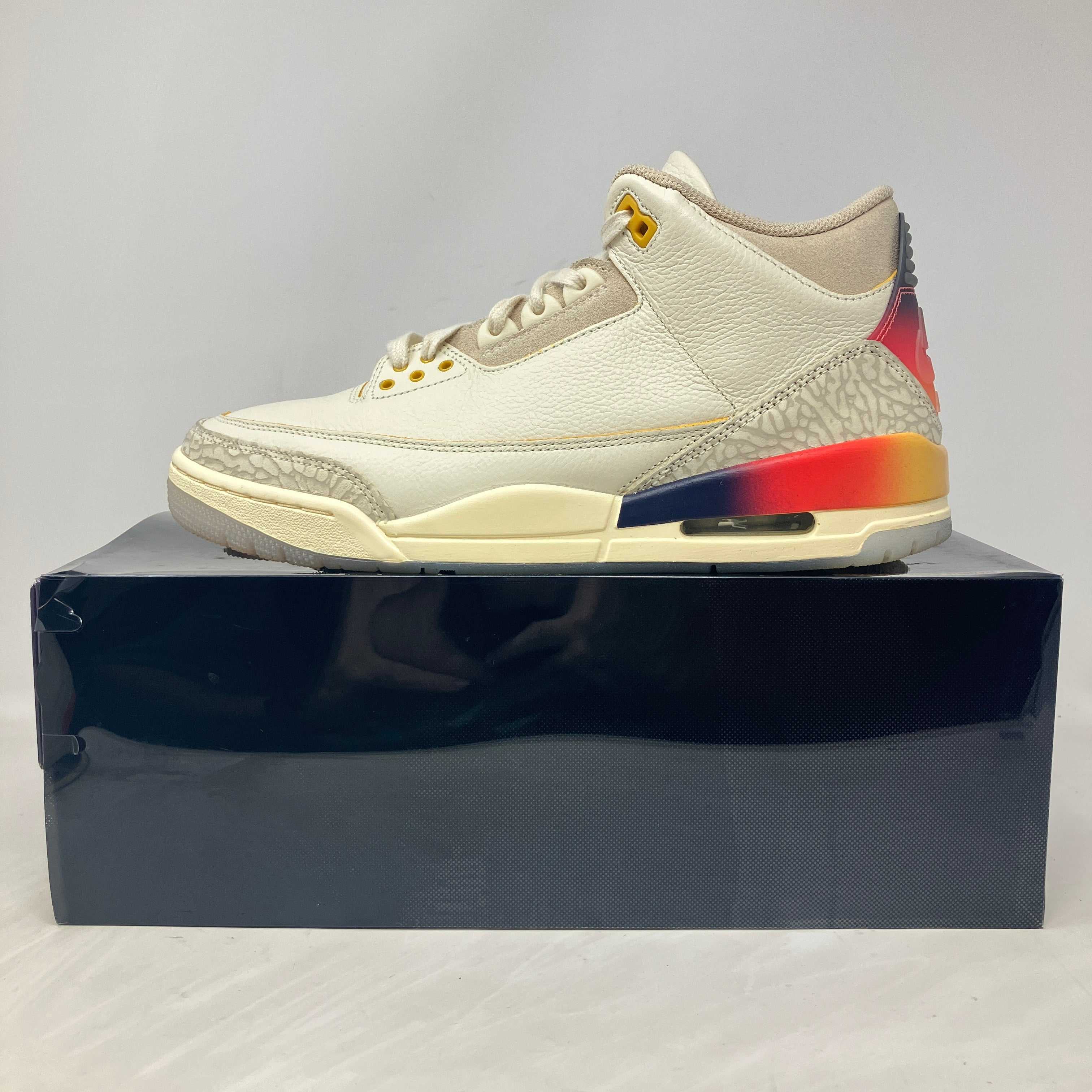 Jordan 3 Retro SP J Balvin Medellín Sunset sneaker side view on box with sunset gradient detail