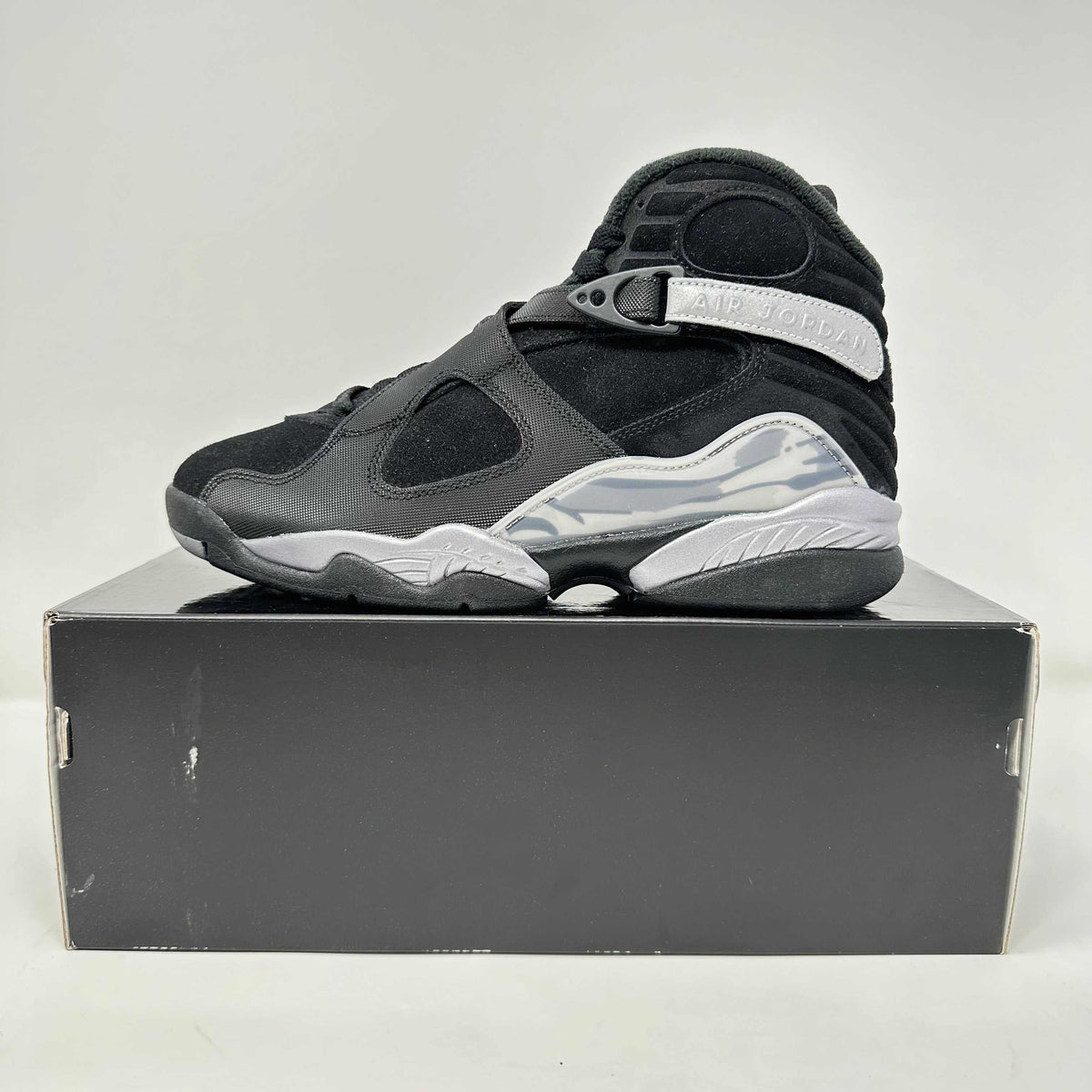 Jordan 8 Retro black and grey high-top sneaker with suede and synthetic materials and white midsole detailing