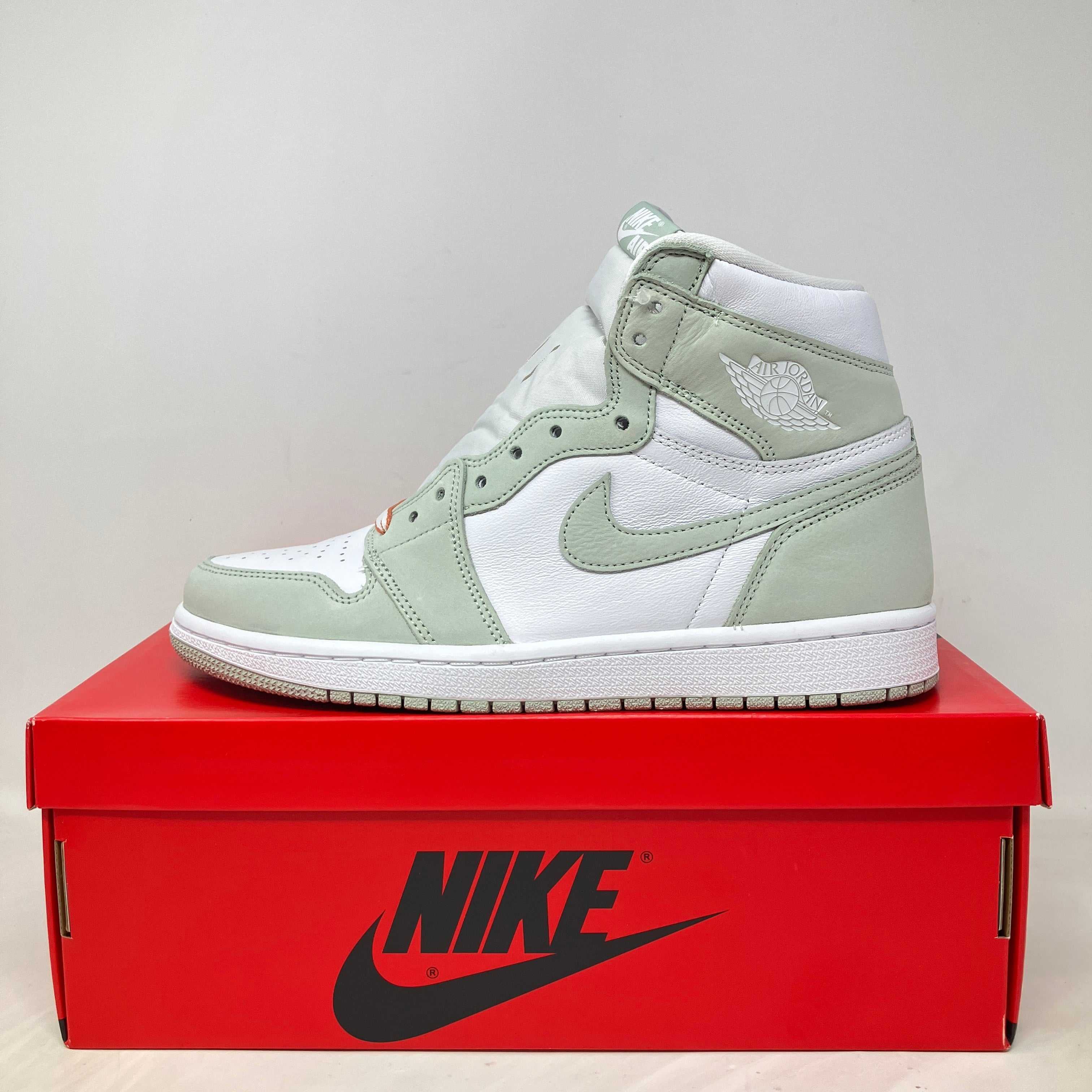 Jordan 1 Retro High OG Seafoam women's sneaker on red Nike box, brand new with accessories