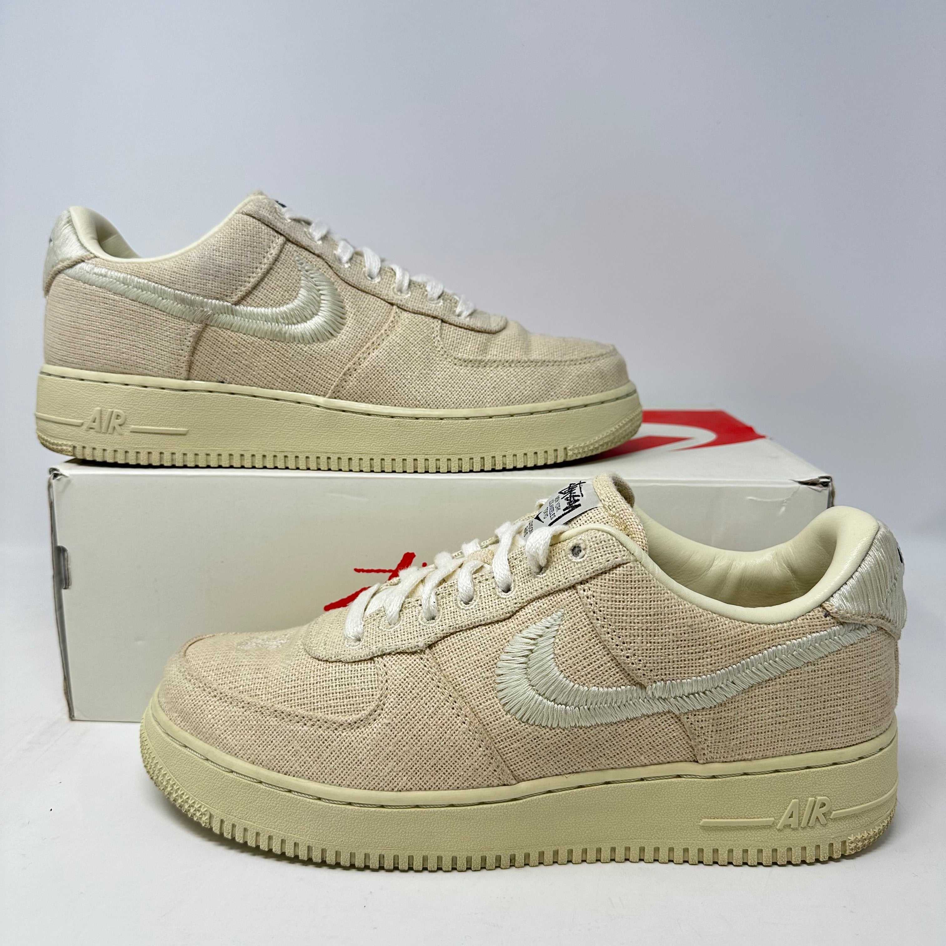 Nike Air Force 1 Low Stussy Fossil sneakers on box, pre-owned.