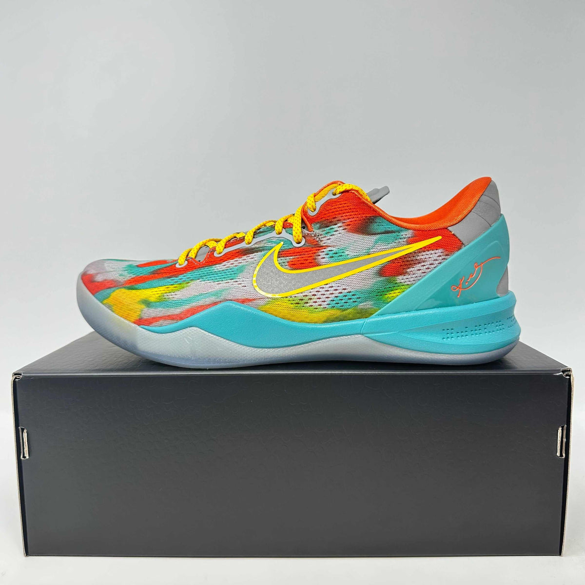 Nike Kobe 8 Protro basketball shoe in multicolor with turquoise sole, yellow laces, orange collar, and signature detailing.