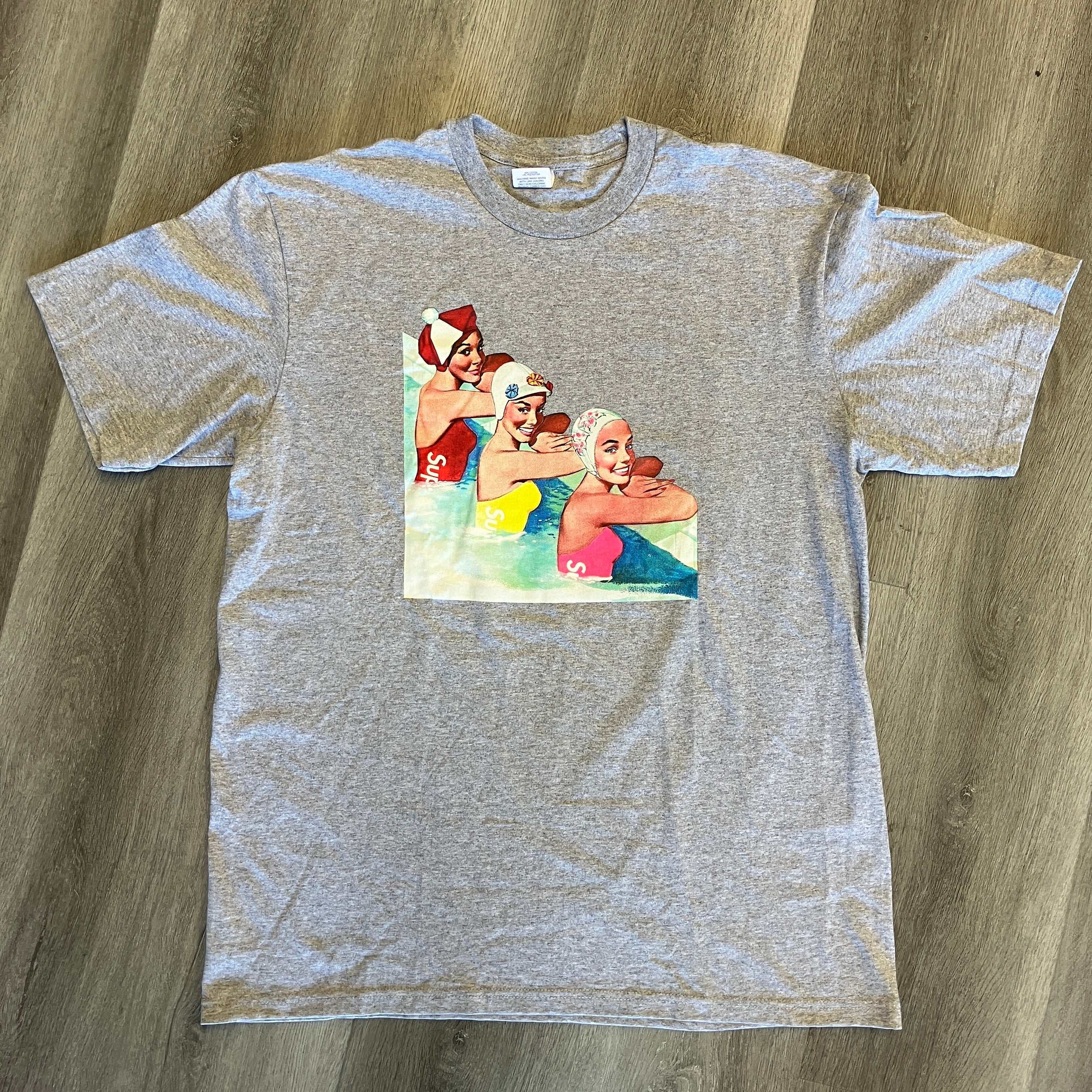 Heather grey Supreme Swimmers Tee with colorful swimmer graphic, size 21" pit to pit and 30" length, brand new condition