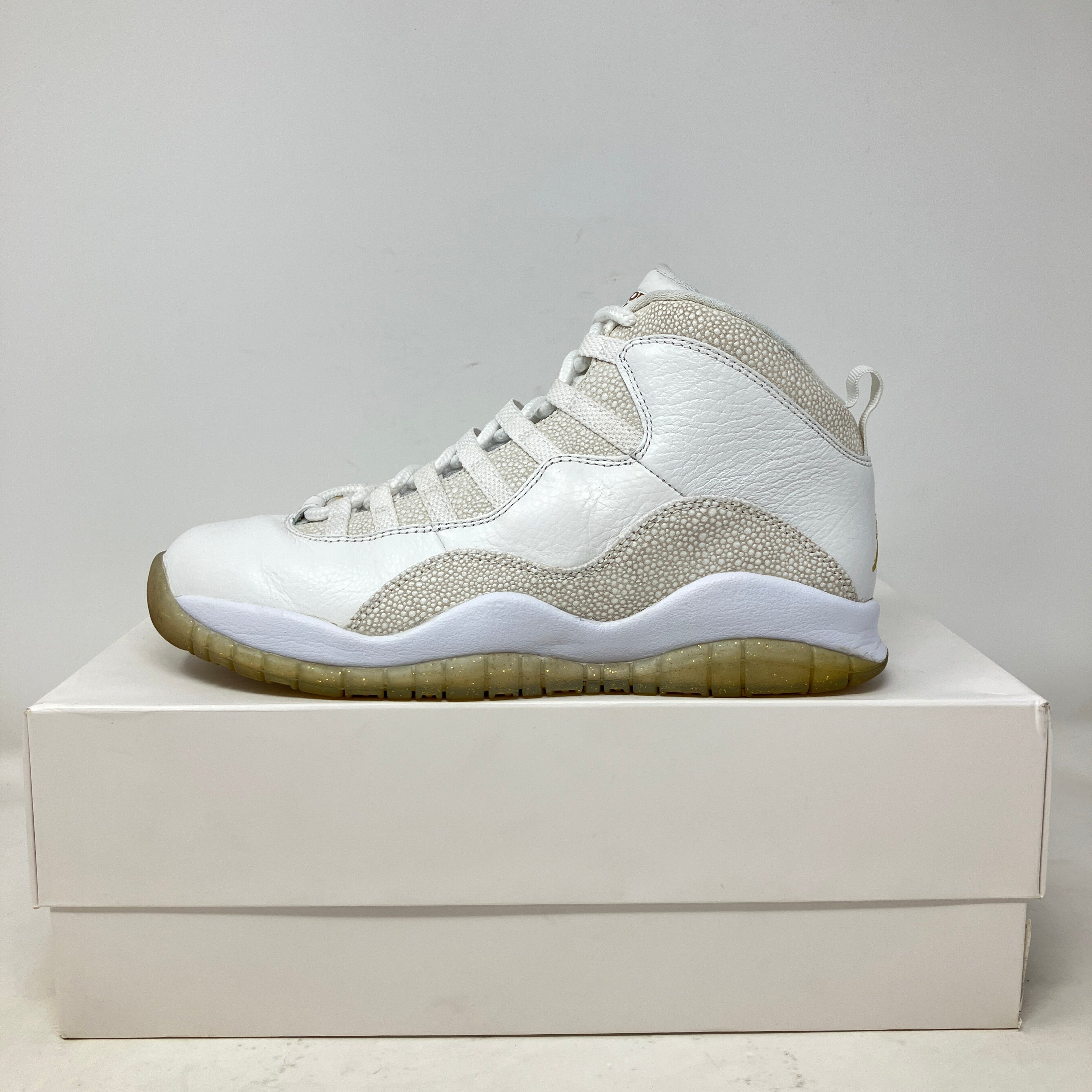 Jordan 10 Retro Drake OVO White sneaker side view on white box, pre-owned condition with all accessories included