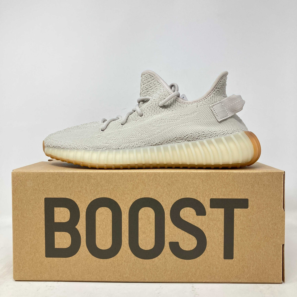 adidas Yeezy Boost 350 V2 Sesame sneaker in light beige knit with ribbed translucent sole and gum outsole on Boost box