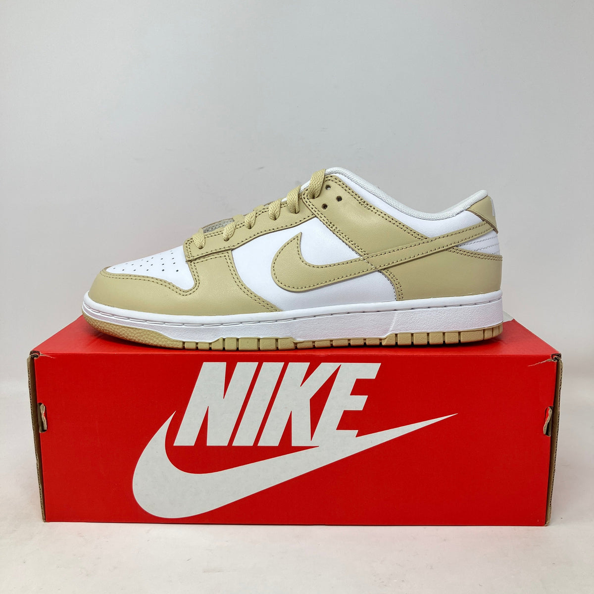 Nike Dunk Low Team Gold sneaker in brand new condition on red Nike box.