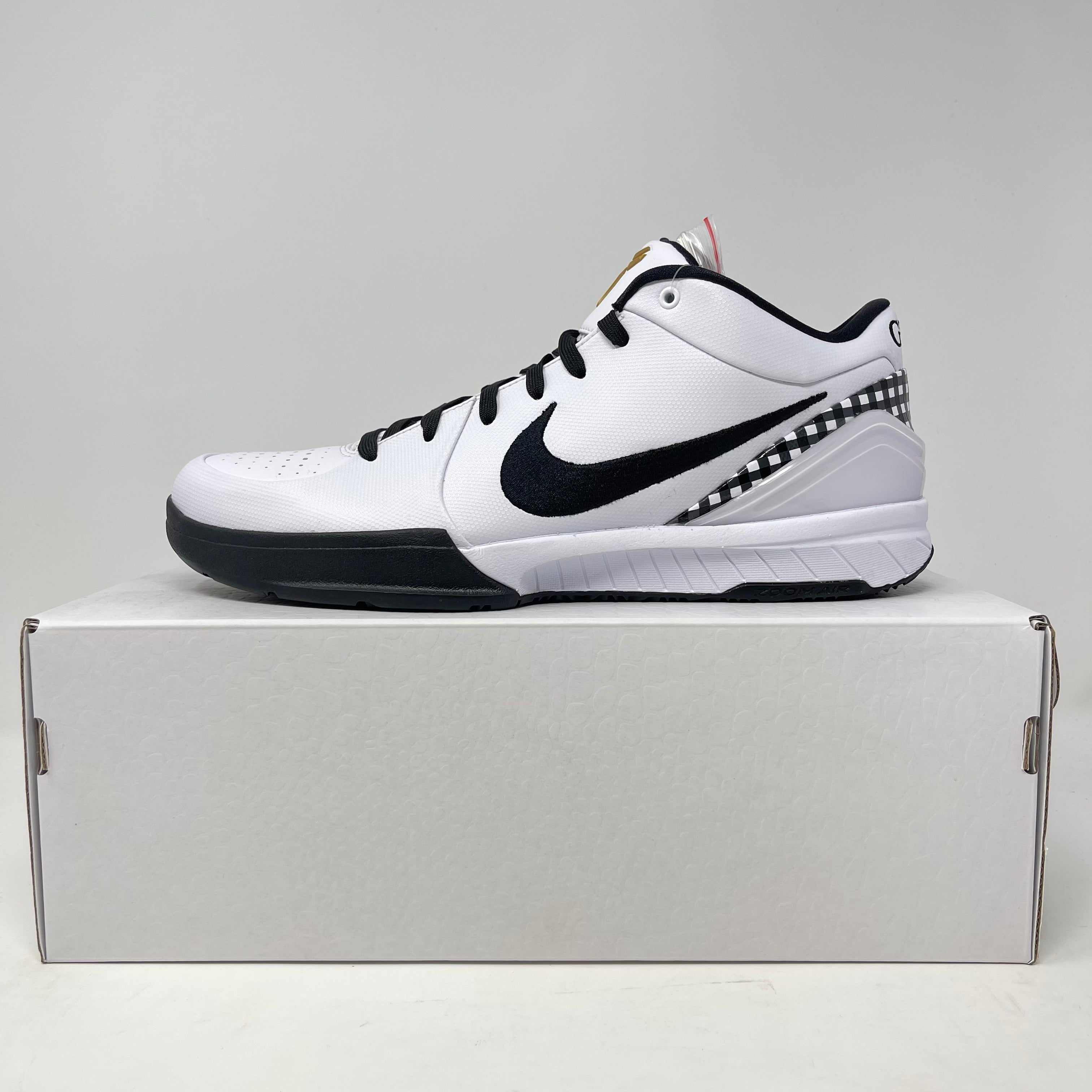 White and black Nike Kobe 4 Protro Mambacita Gigi sneaker displayed on a white shoebox