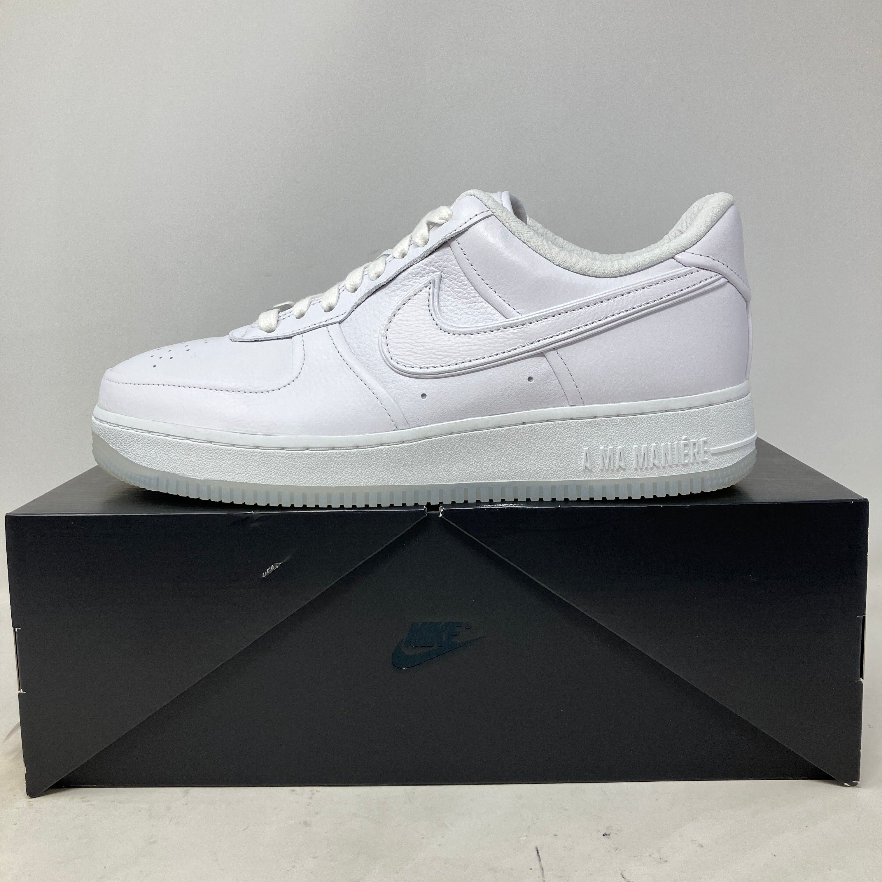 White Nike Air Force 1 Low SP A Ma Maniére women's sneaker on black Nike box