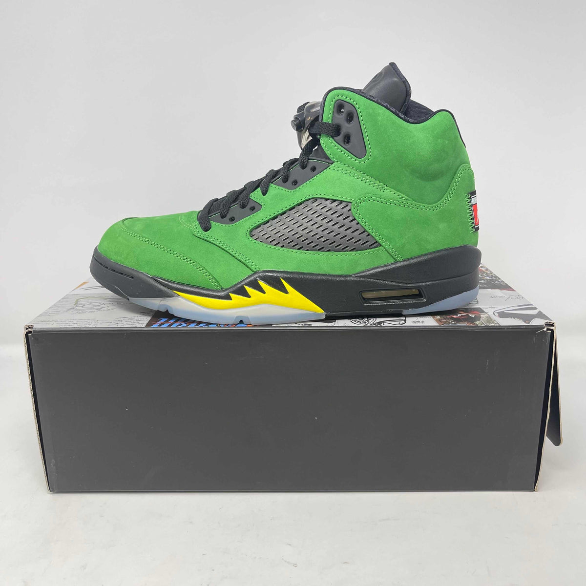 Jordan 5 Retro SE Oregon high-top sneaker in bright green suede with black mesh panels, grey details and a yellow accent.