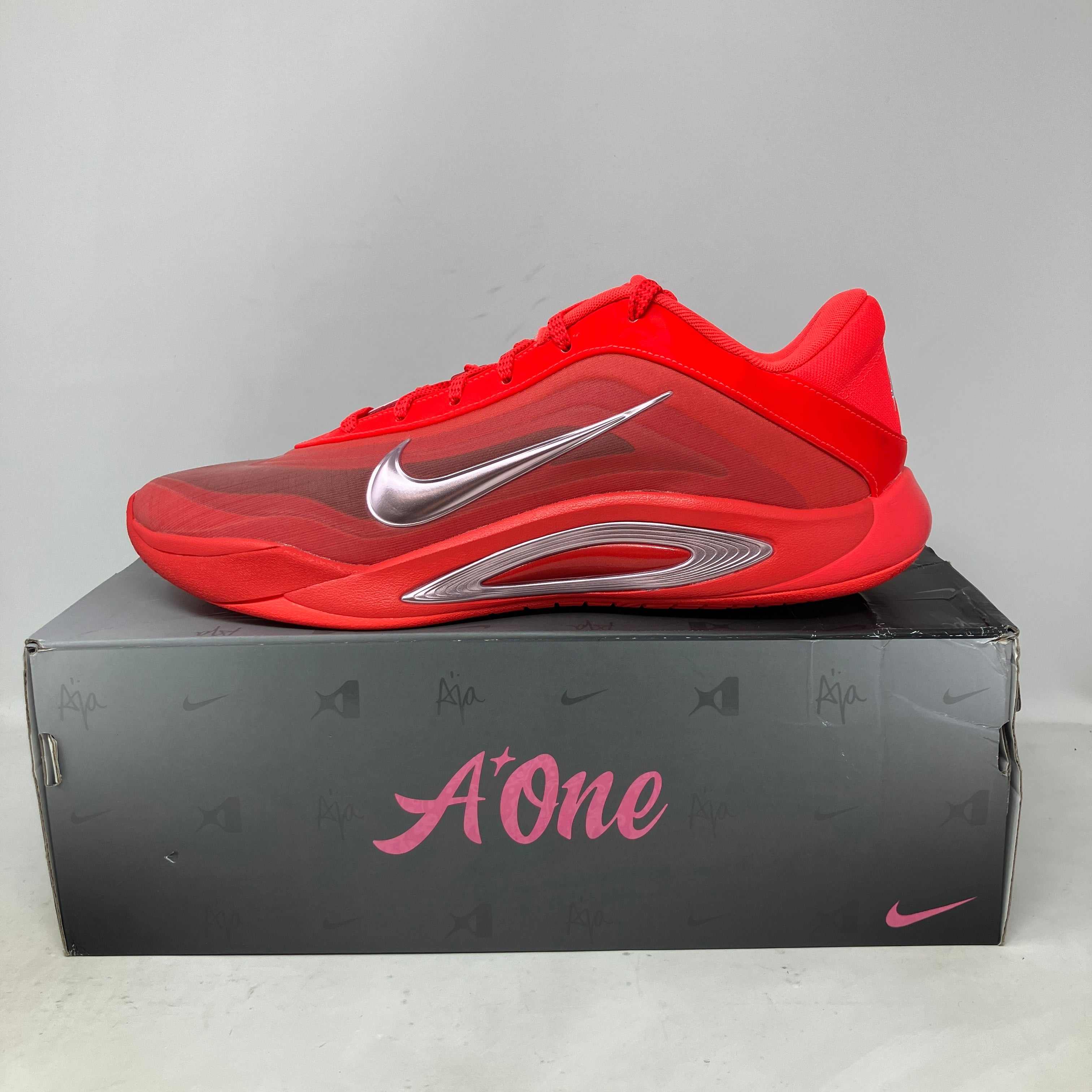 Nike A'One bright crimson pink women's sneaker on A'One branded box