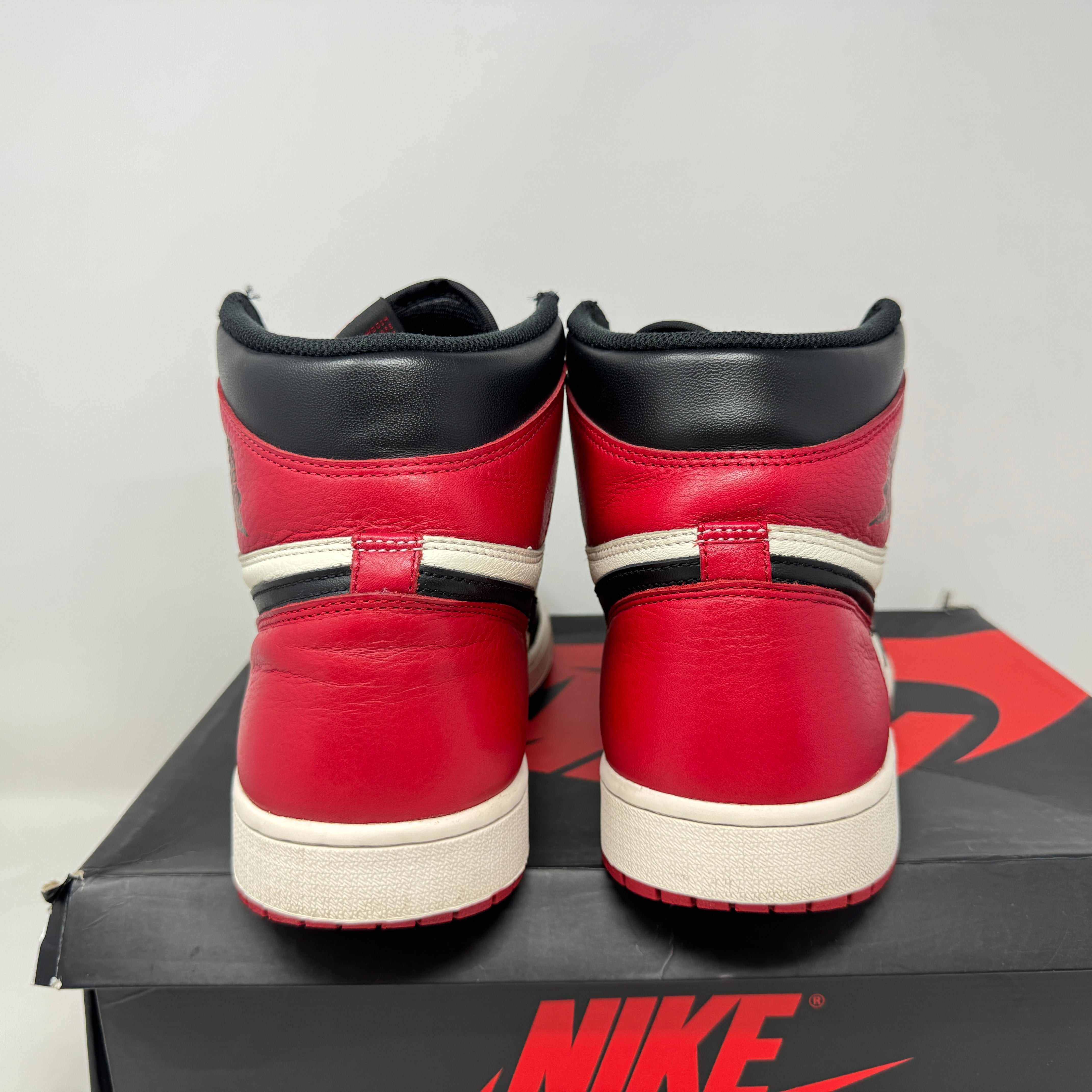 Jordan 1 Retro High Bred Toe preowned sneakers with original accessories.