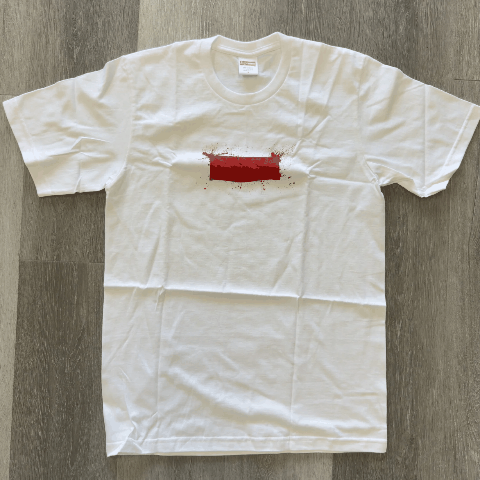 White Supreme Ralph Steadman box logo tee with red graphic, brand new condition.