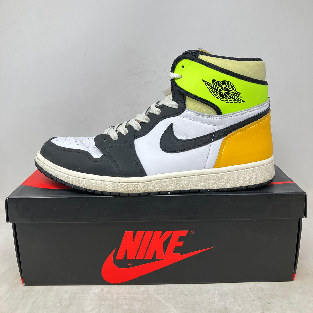 Jordan 1 Retro High White Black Volt University Gold – Hidden Realm