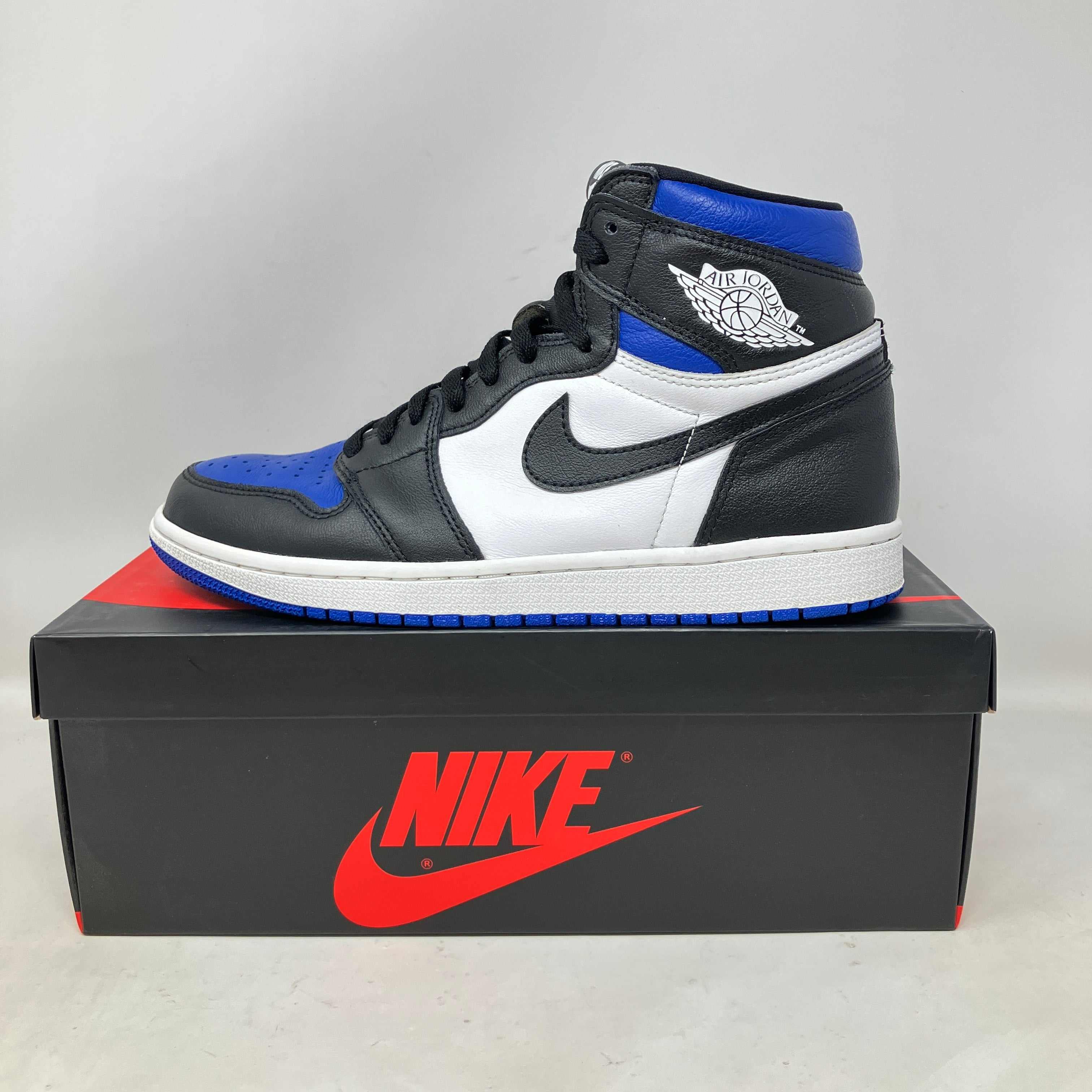 Jordan 1 Retro High Royal Toe sneaker in black, white, and blue on Nike box