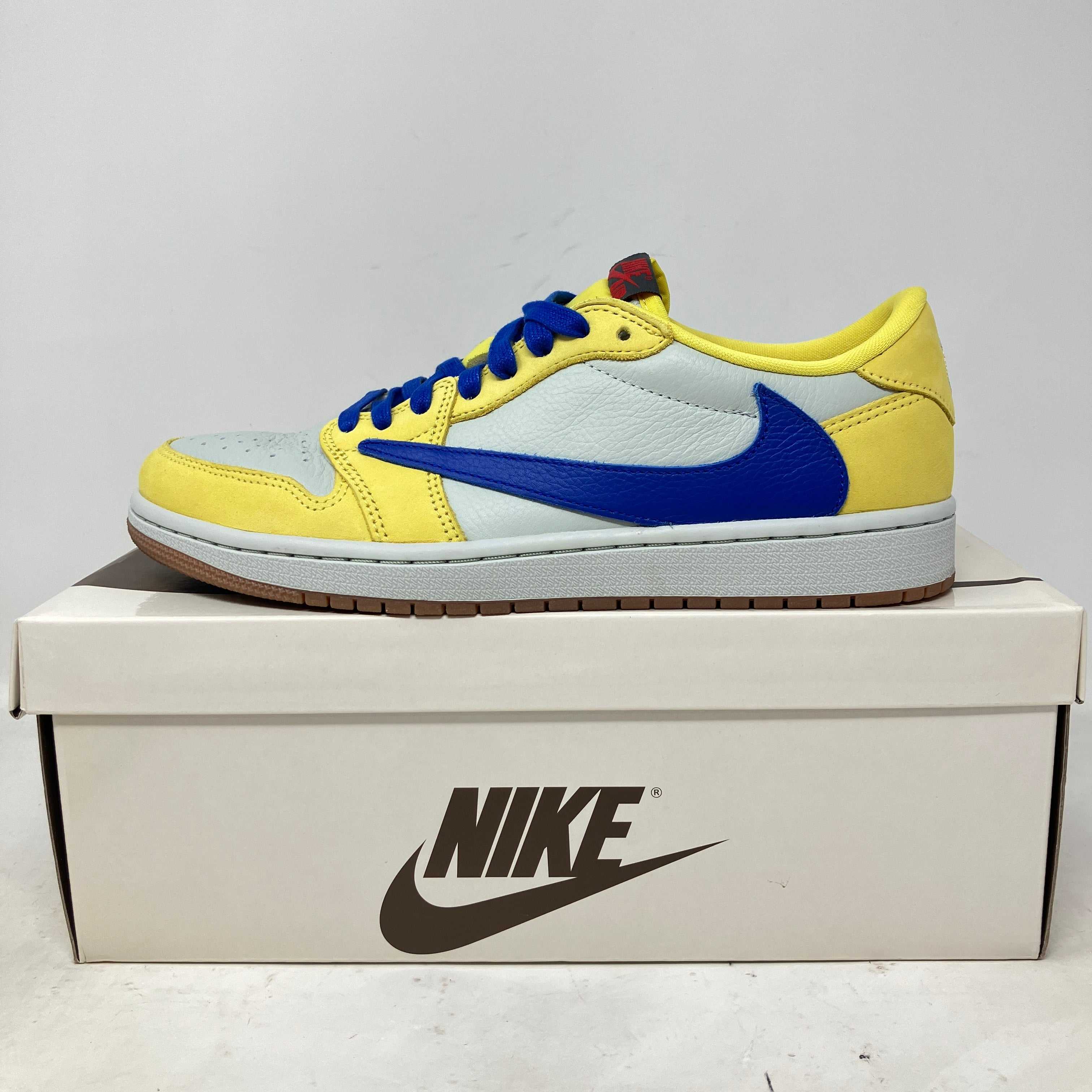 Jordan 1 Retro Low OG Travis Scott Canary women's sneaker side view on Nike box