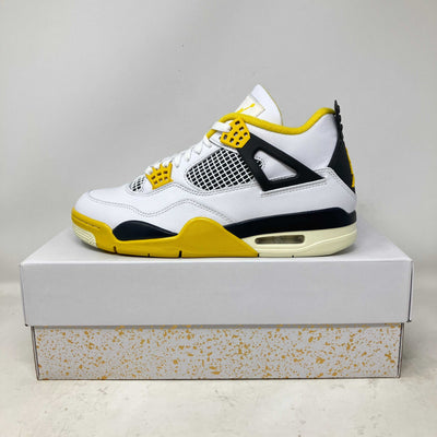 Jordan 4 Retro Vivid Sulfur women's sneaker in white, yellow, and black on a box