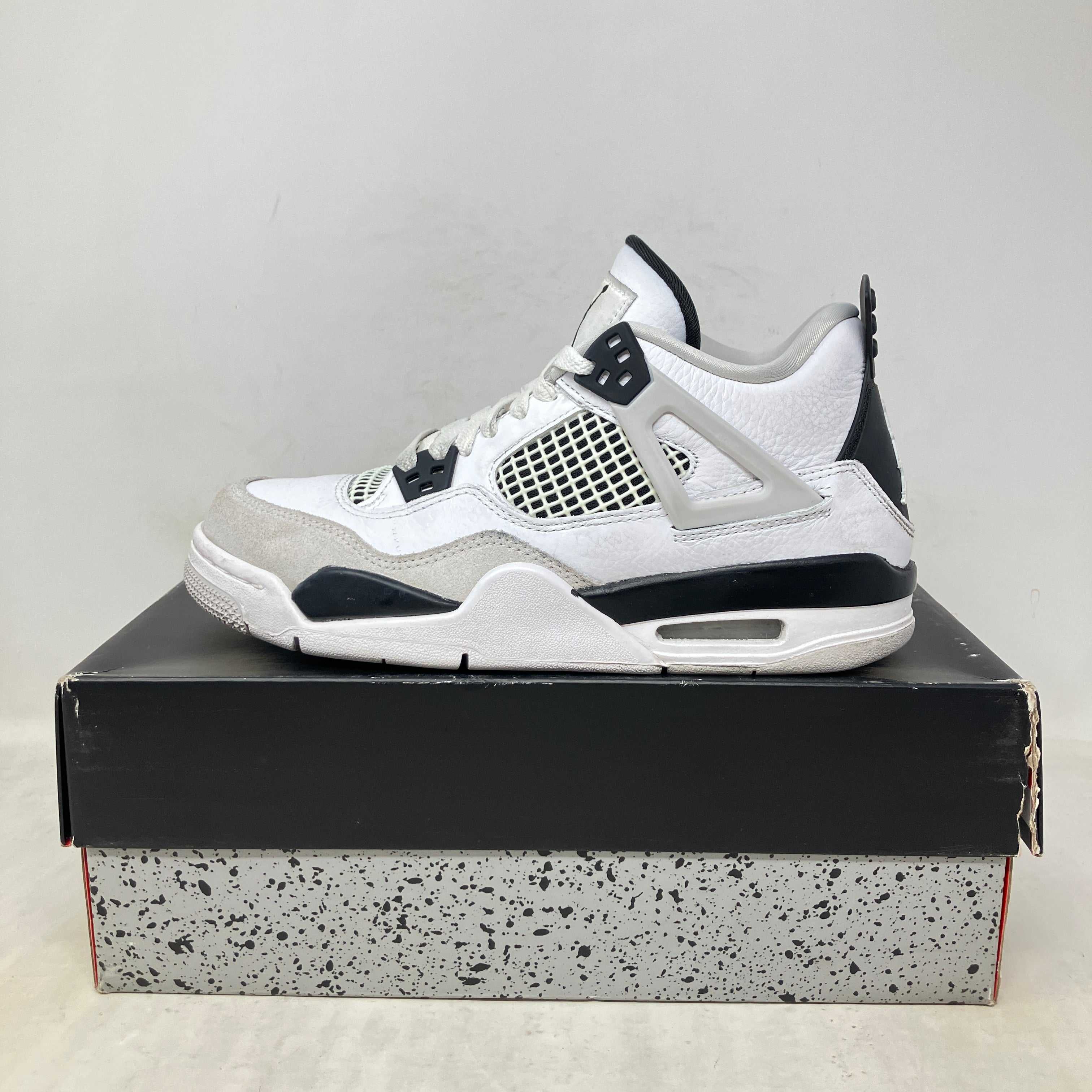 Jordan 4 Retro Military Black GS pre-owned sneakers with accessories included