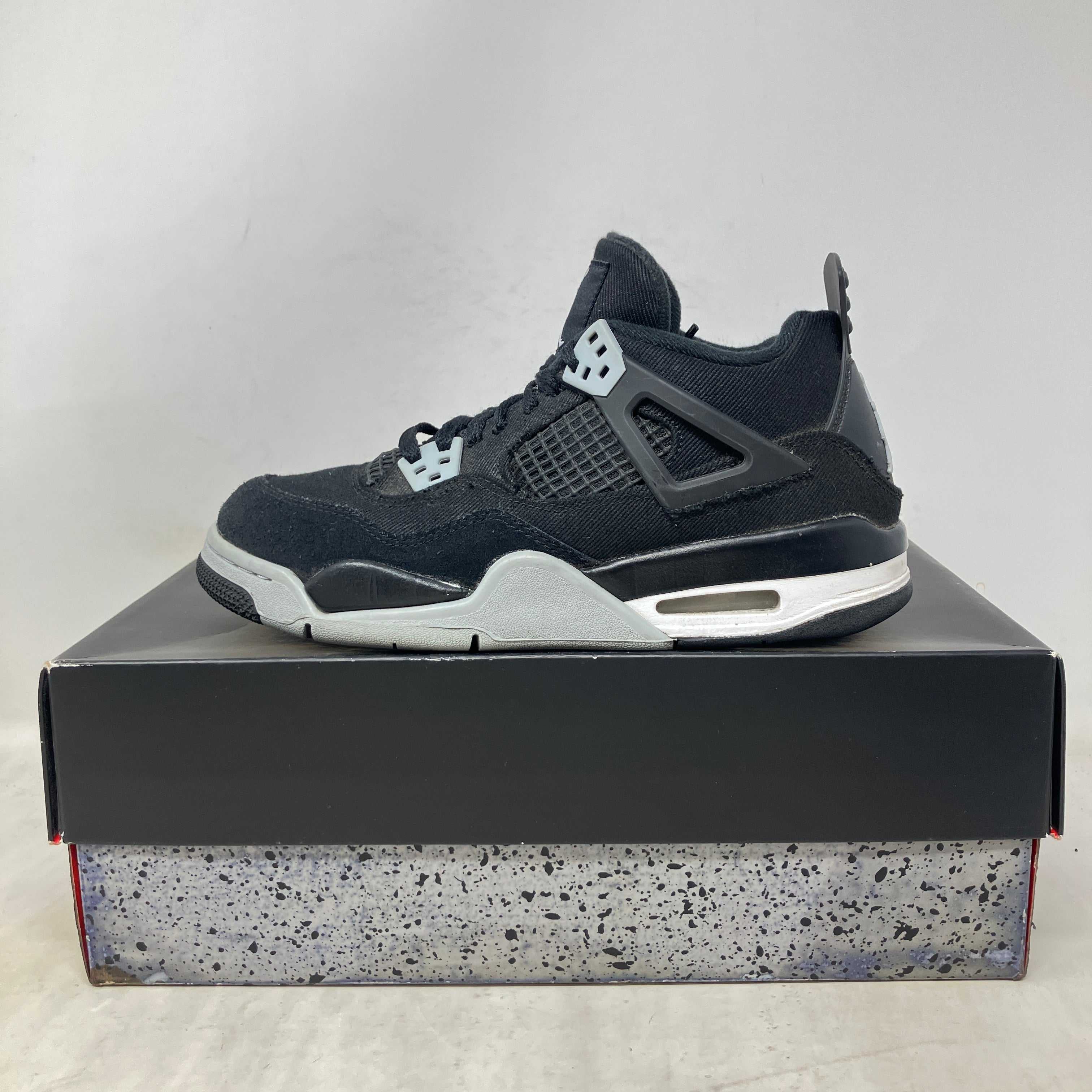 Jordan 4 Retro Black Canvas GS pre-owned sneakers with replacement box
