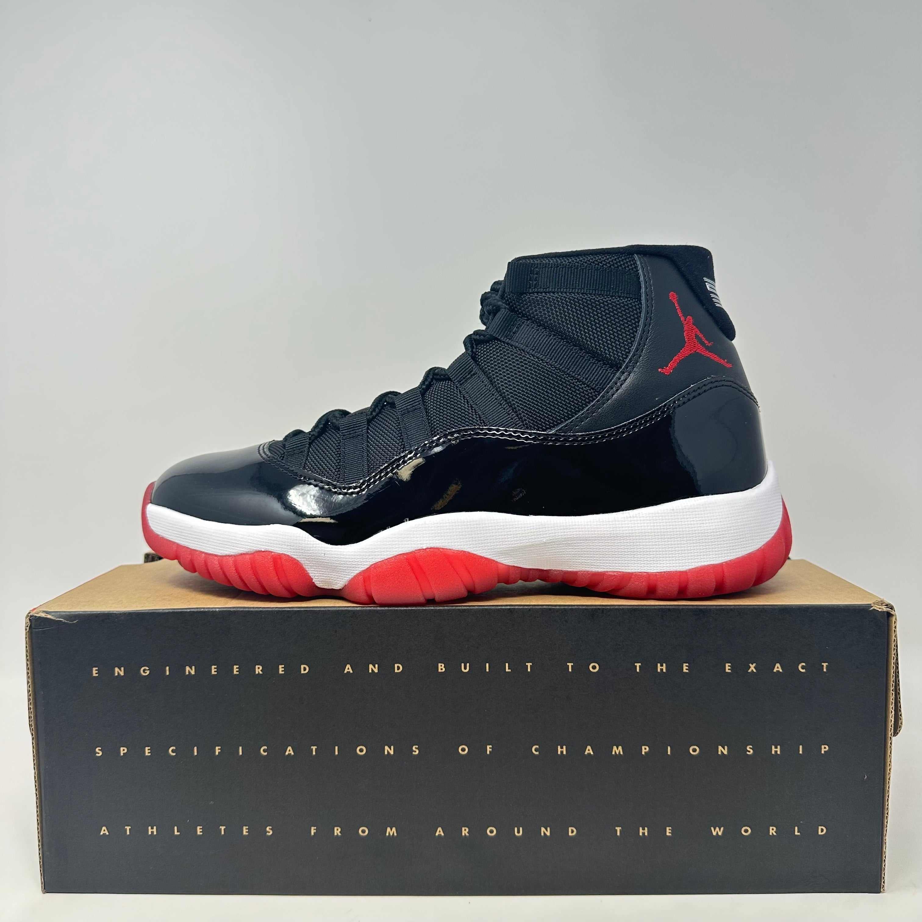 Jordan 11 Retro Playoffs Bred 2019 sneaker in black and red on box with accessories included