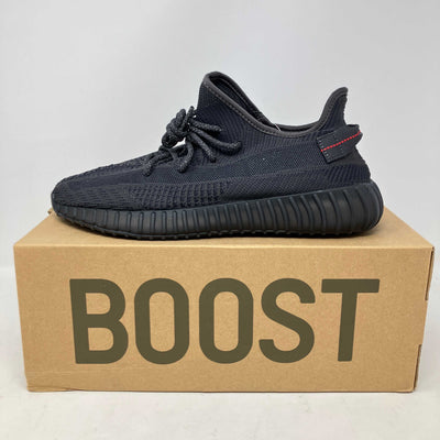 adidas Yeezy Boost 350 V2 black knit sneaker with ribbed sole and red accent on heel tab, non-reflective design