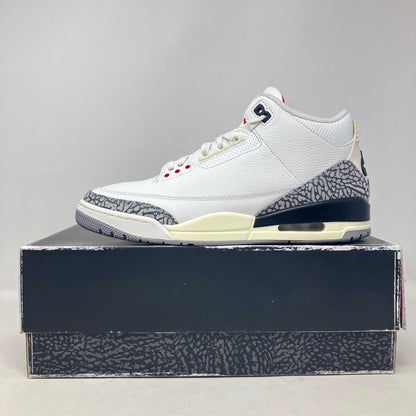 Side view of pre-owned Jordan 3 Retro White Cement sneaker on box with all accessories included