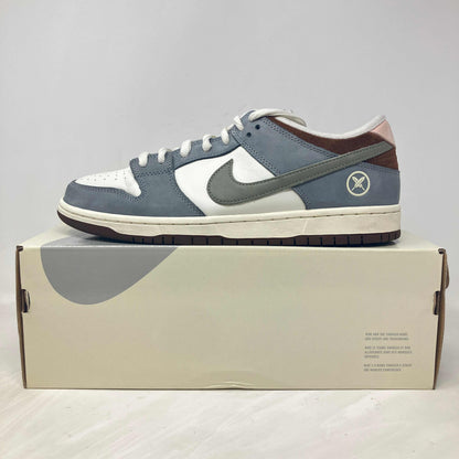 Nike SB Dunk Low Yuto Horigome sneaker in gray and white on box, pre-owned with accessories